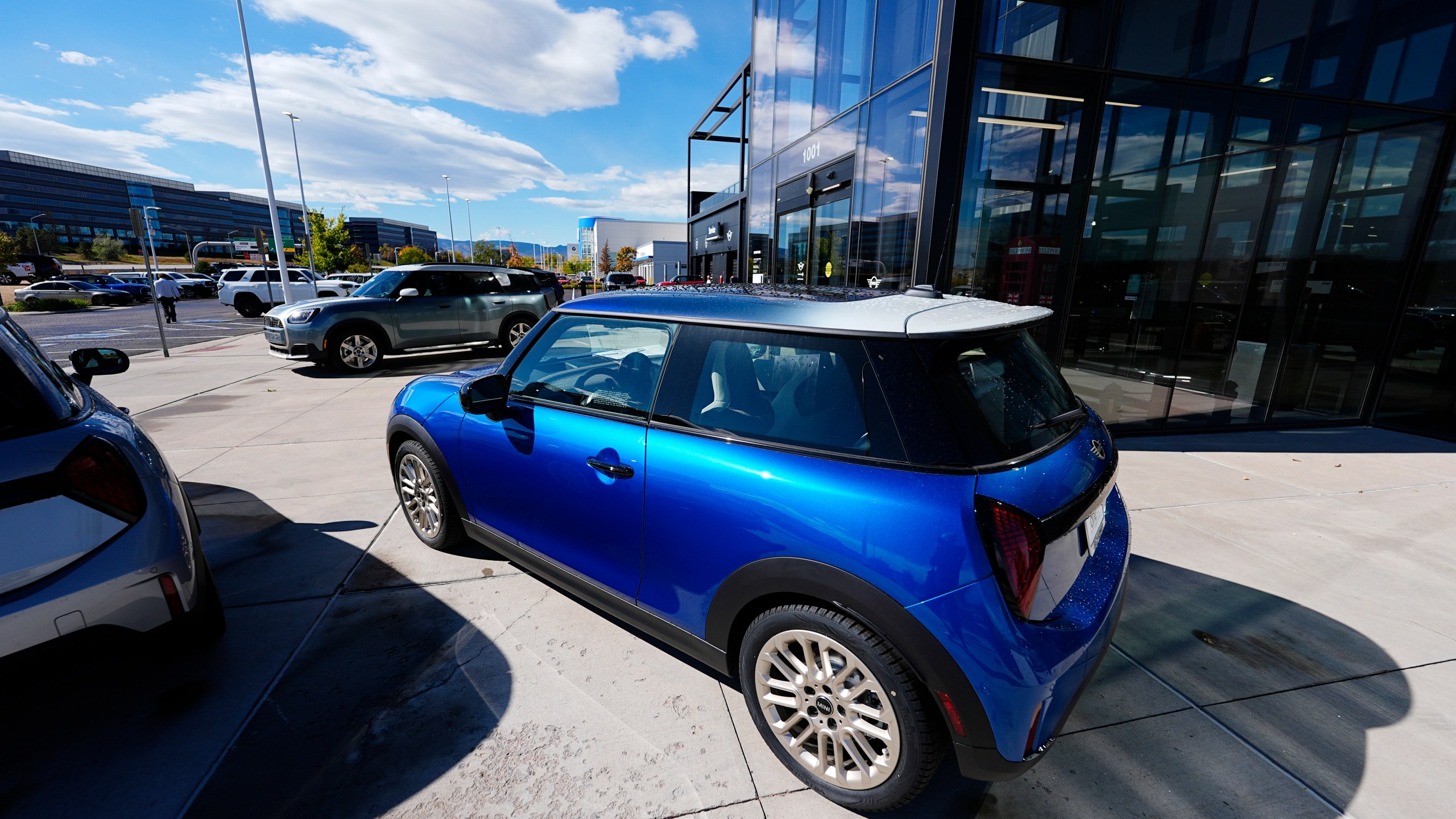 FILE - Unsold 2025 Countryman sports-utility vehicles and Cooper S hardtops sit on display at a Mini dealership Oct. 21, 2024, in Highlands Ranch, Colo. (AP Photo/David Zalubowski, File)