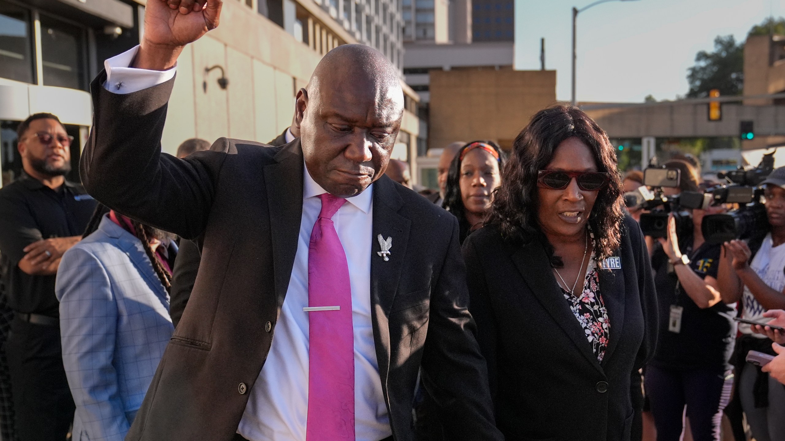 FILE - Attorney Ben Crump, left, RowVaughn Wells, right, leave the federal courthouse after three former Memphis police officers were convicted of witness tampering charges in the 2023 fatal beating of Tyre Nichols, Oct. 3, 2024, in Memphis, Tenn. (AP Photo/George Walker IV, File)