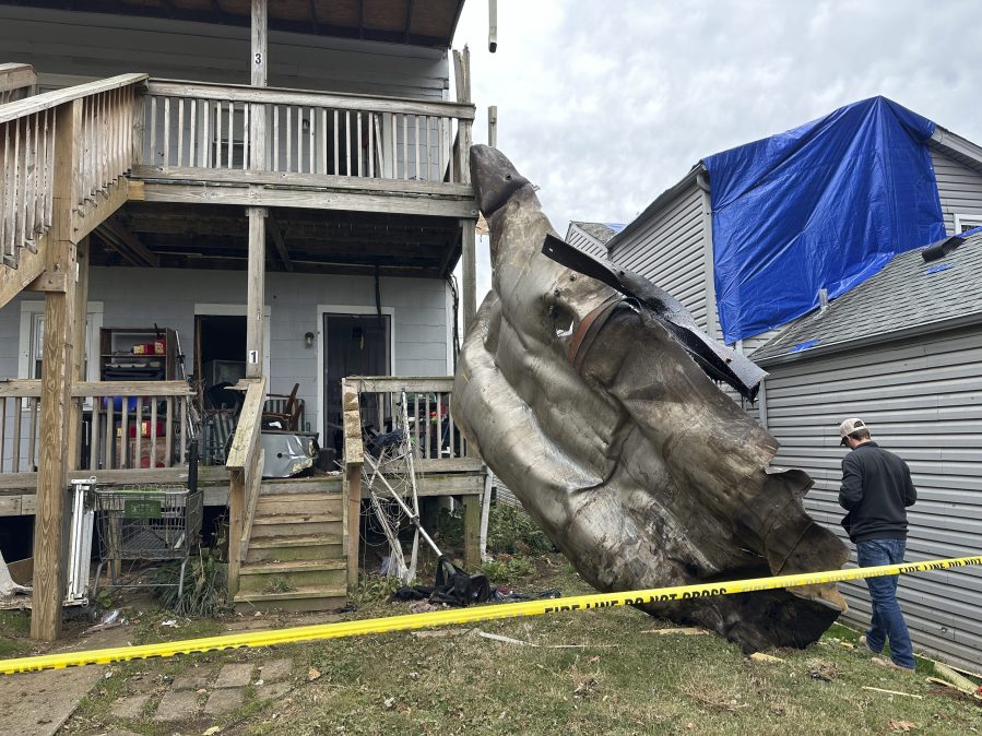 A massive piece of debris that flew from the Givaudan Color Sense plant after an explosion is pictured on Wednesday, Nov. 13, 2024 in Louisville, Ky. (AP Photo/Dylan Lovan)