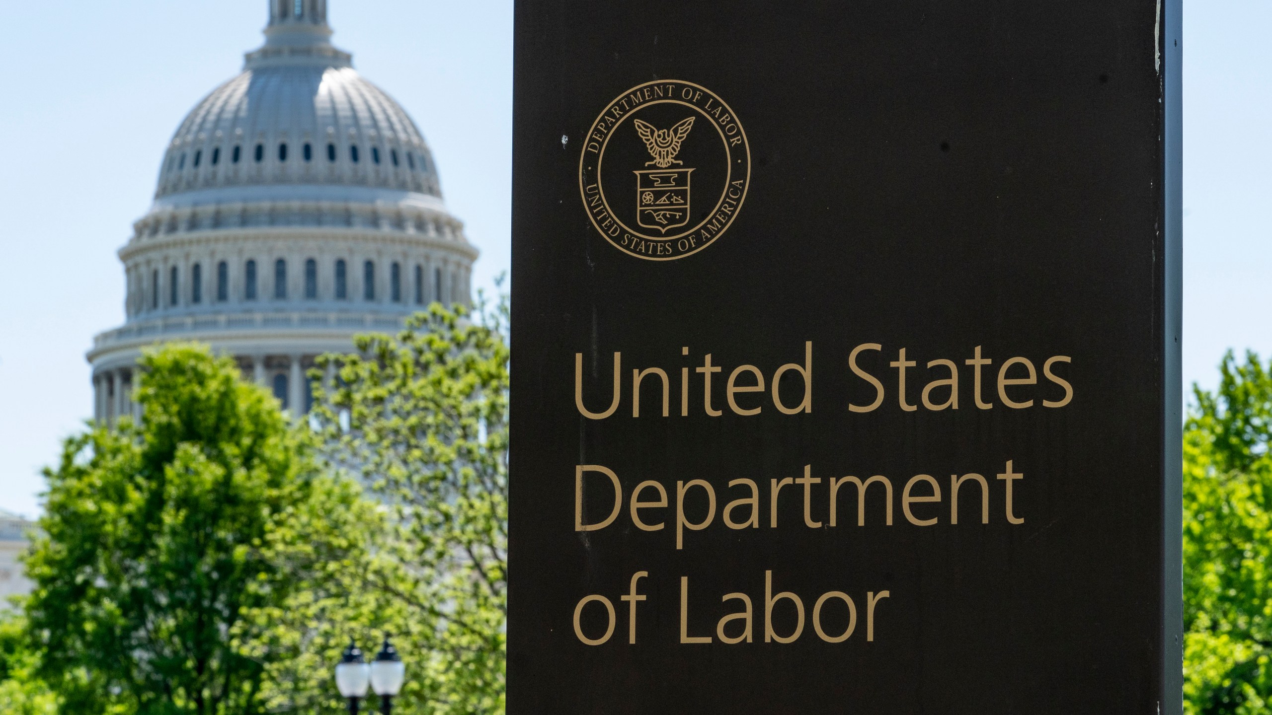 FILE - The entrance to the Labor Department is seen near the Capitol in Washington, Thursday, May 7, 2020. (AP Photo/J. Scott Applewhite, File)