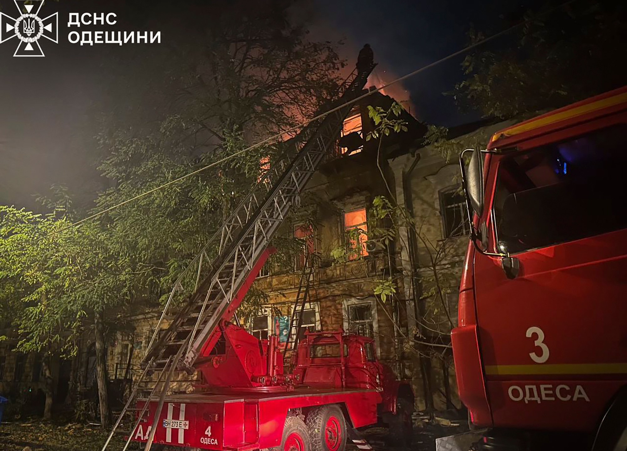 In this photo provided by the Ukrainian Emergency Service, emergency services personnel work to extinguish a fire following a Russian attack in Odesa, Ukraine, late Thursday, Nov. 14, 2024. (Ukrainian Emergency Service via AP)