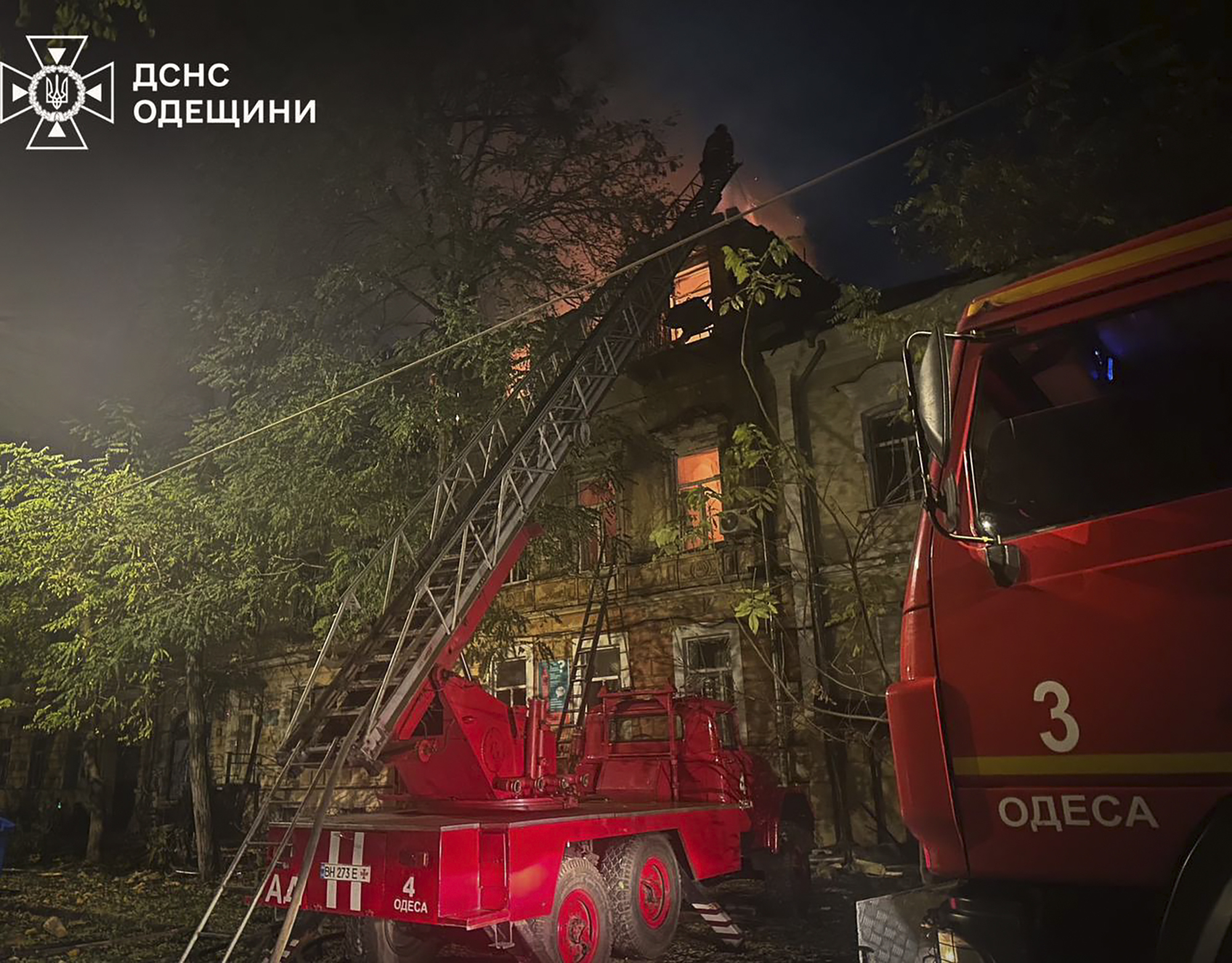 In this photo provided by the Ukrainian Emergency Service, emergency services personnel work to extinguish a fire following a Russian attack in Odesa, Ukraine, late Thursday, Nov. 14, 2024. (Ukrainian Emergency Service via AP)