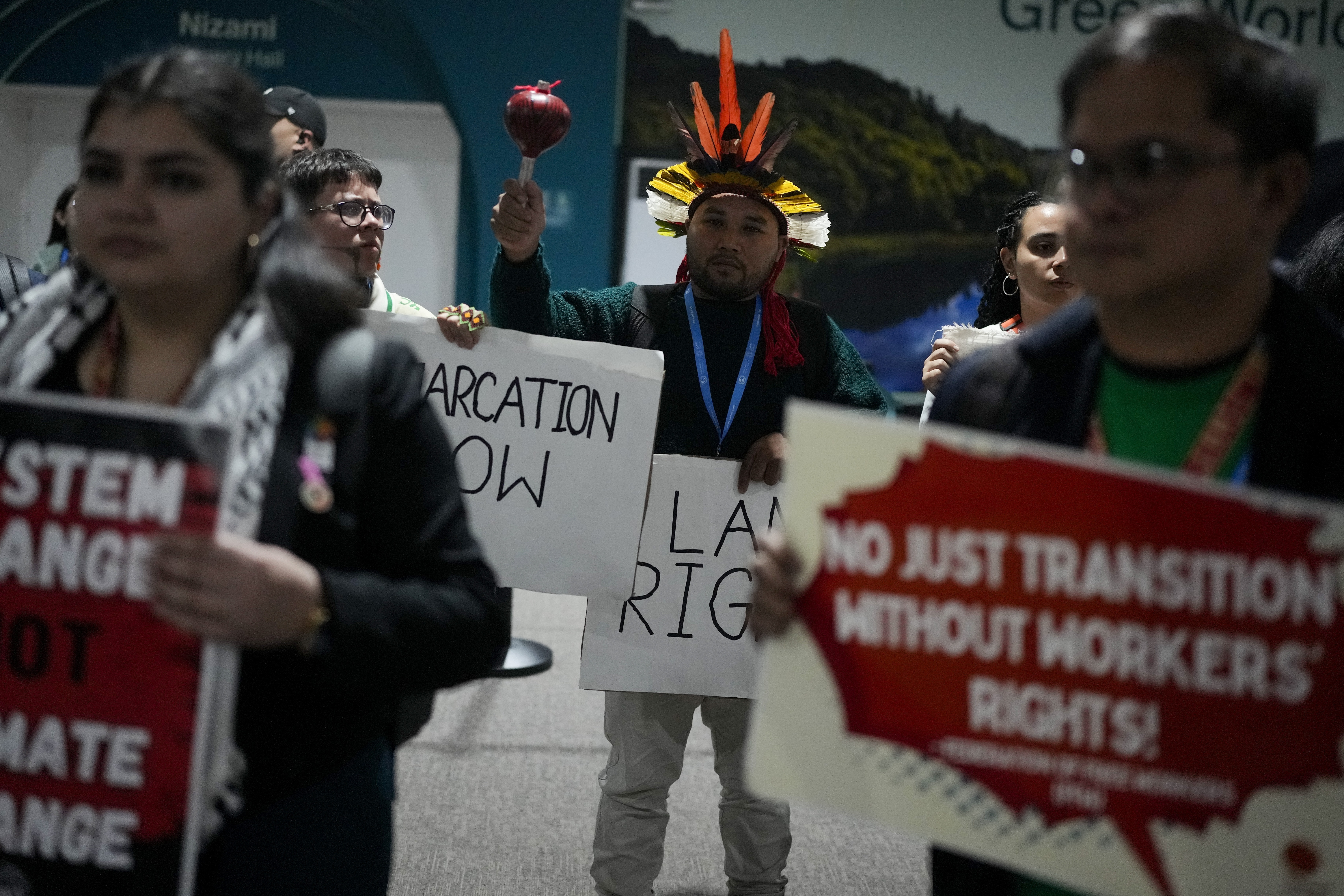 Activists participate in a demonstration at the COP29 U.N. Climate Summit, Saturday, Nov. 16, 2024, in Baku, Azerbaijan. (AP Photo/Rafiq Maqbool)