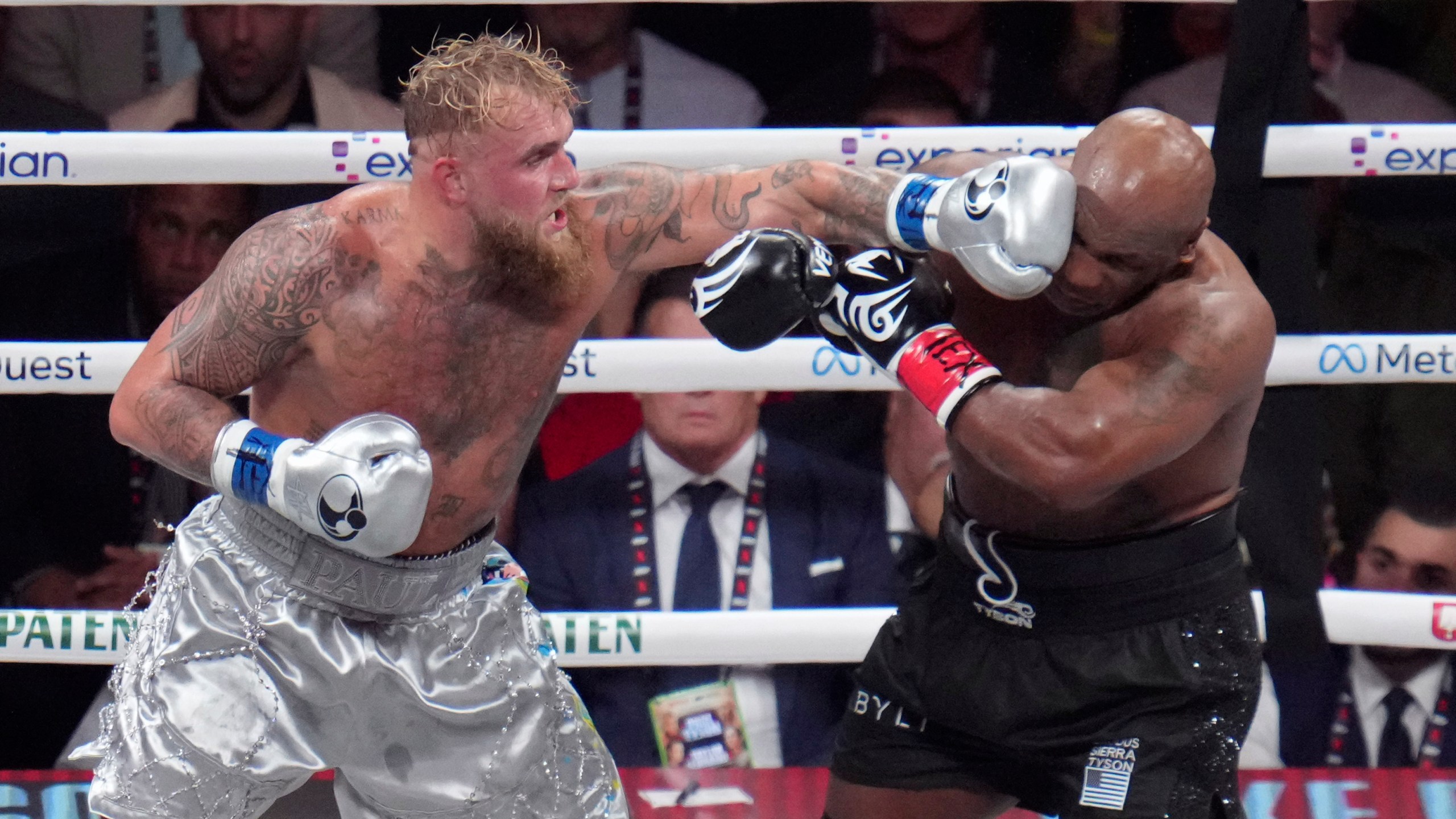 Jake Paul lands a left to Mike Tyson during their heavyweight boxing match, Friday, Nov. 15, 2024, in Arlington, Texas. (AP Photo/Julio Cortez)