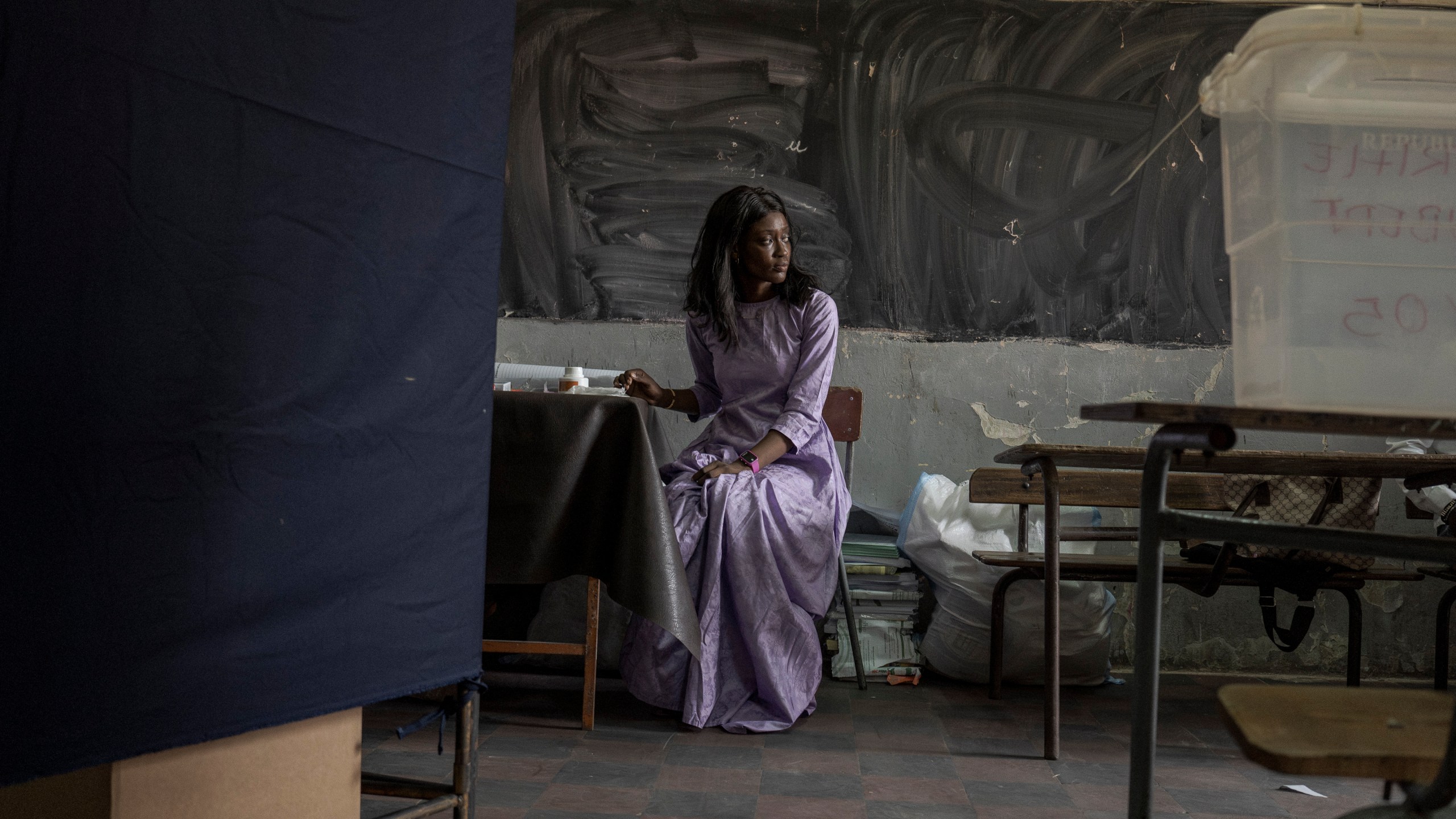 An electoral employee begins the assembly of a voting station for legislative elections in Dakar, Senegal Sunday, Nov. 17, 2024. (AP Photo/Annika Hammerschlag)