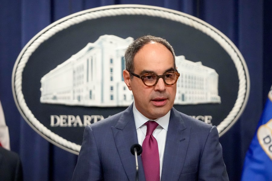 FILE - Assistant Attorney General Jonathan Kanter of the Justice Department's Antitrust Division speaks with reporters during a news conference at the Department of Justice, Aug. 23, 2024, in Washington. (AP Photo/Mark Schiefelbein, File)