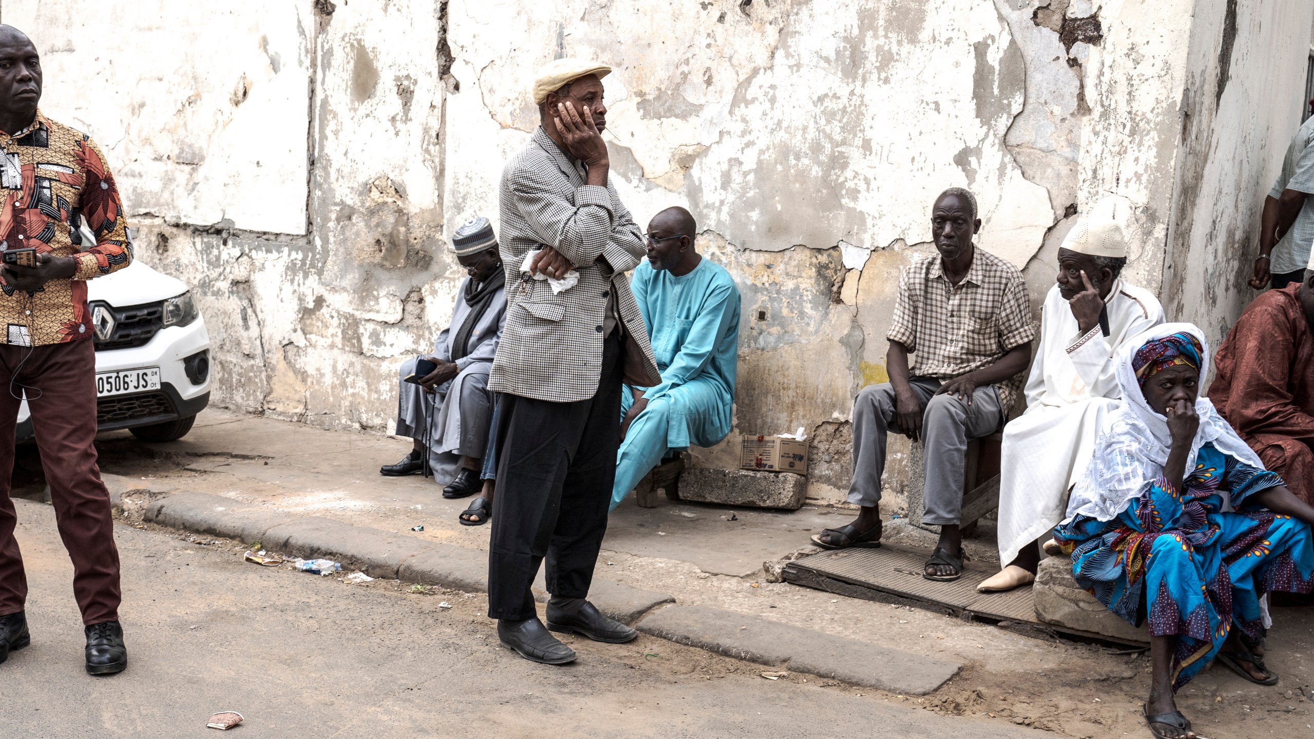 People wait to cast their ballot for legislative elections in Dakar, Senegal Sunday, Nov. 17, 2024. (AP Photo/Annika Hammerschlag)