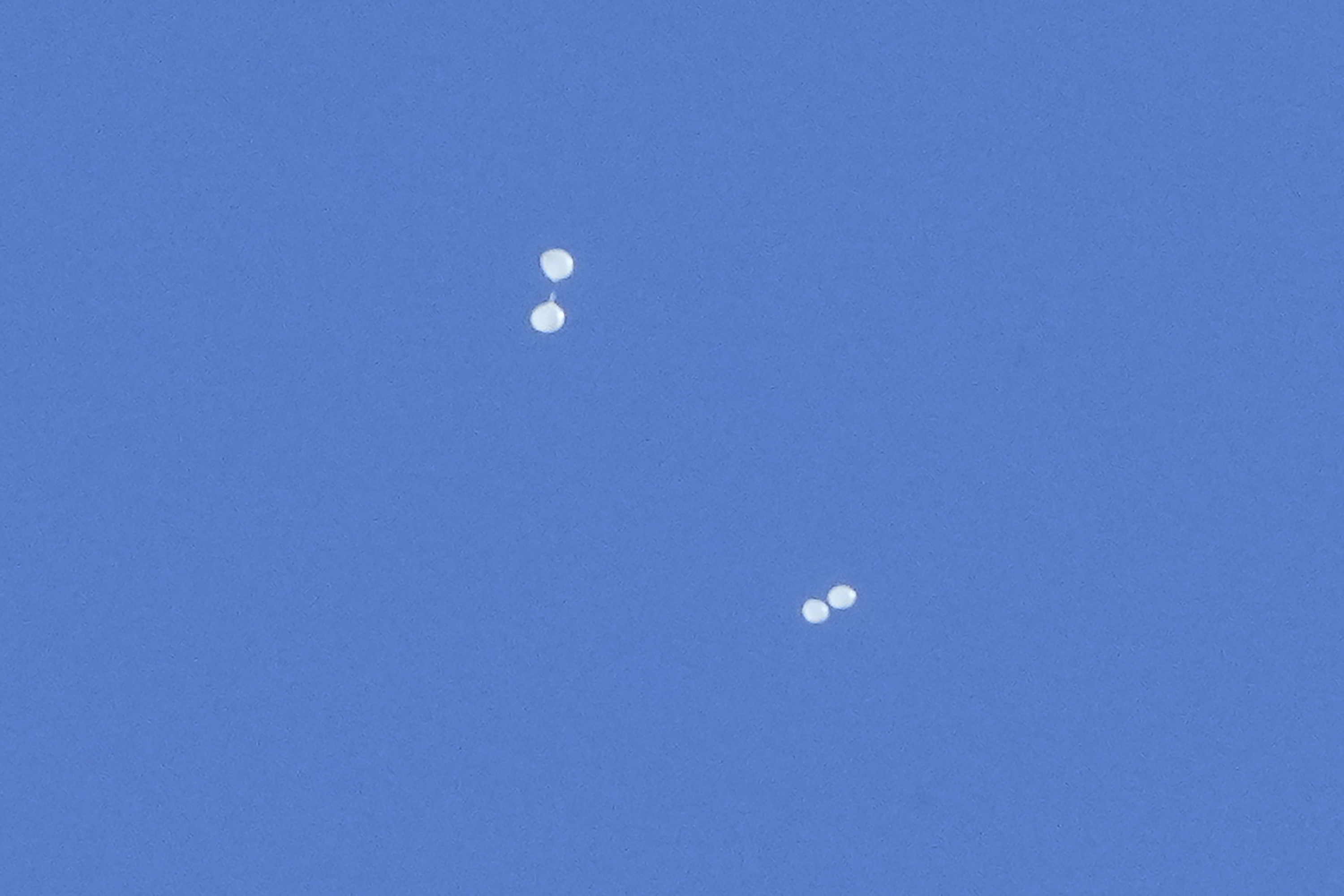 FILE - Balloons carrying what local media reported "trash" are seen in the sky over Seoul, South Korea, on Oct. 2, 2024, as they are also reportedly sent from North Korea. (AP Photo/Ahn Young-joon, File)