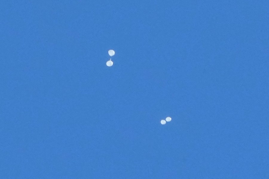 FILE - Balloons carrying what local media reported "trash" are seen in the sky over Seoul, South Korea, on Oct. 2, 2024, as they are also reportedly sent from North Korea. (AP Photo/Ahn Young-joon, File)