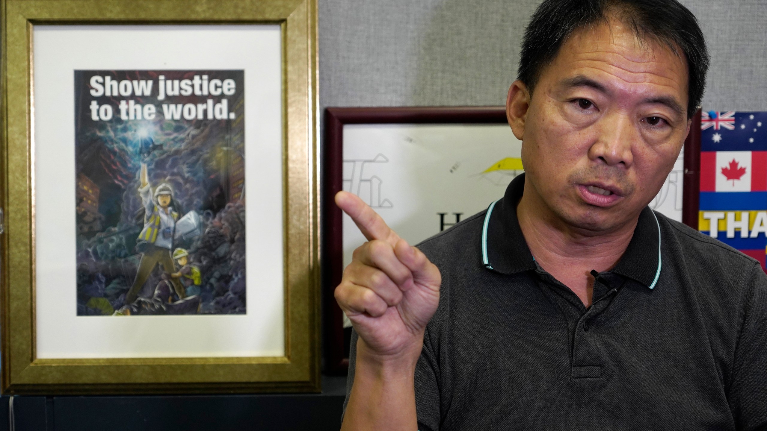 FILE - Pro-democracy lawmaker Wu Chi-wai gestures during an interview at his office in Legislative Council in Hong Kong on Nov. 19, 2020. (AP Photo/Vincent Yu, File)