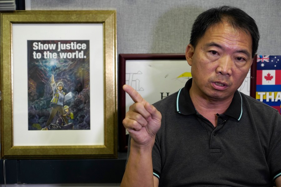 FILE - Pro-democracy lawmaker Wu Chi-wai gestures during an interview at his office in Legislative Council in Hong Kong on Nov. 19, 2020. (AP Photo/Vincent Yu, File)