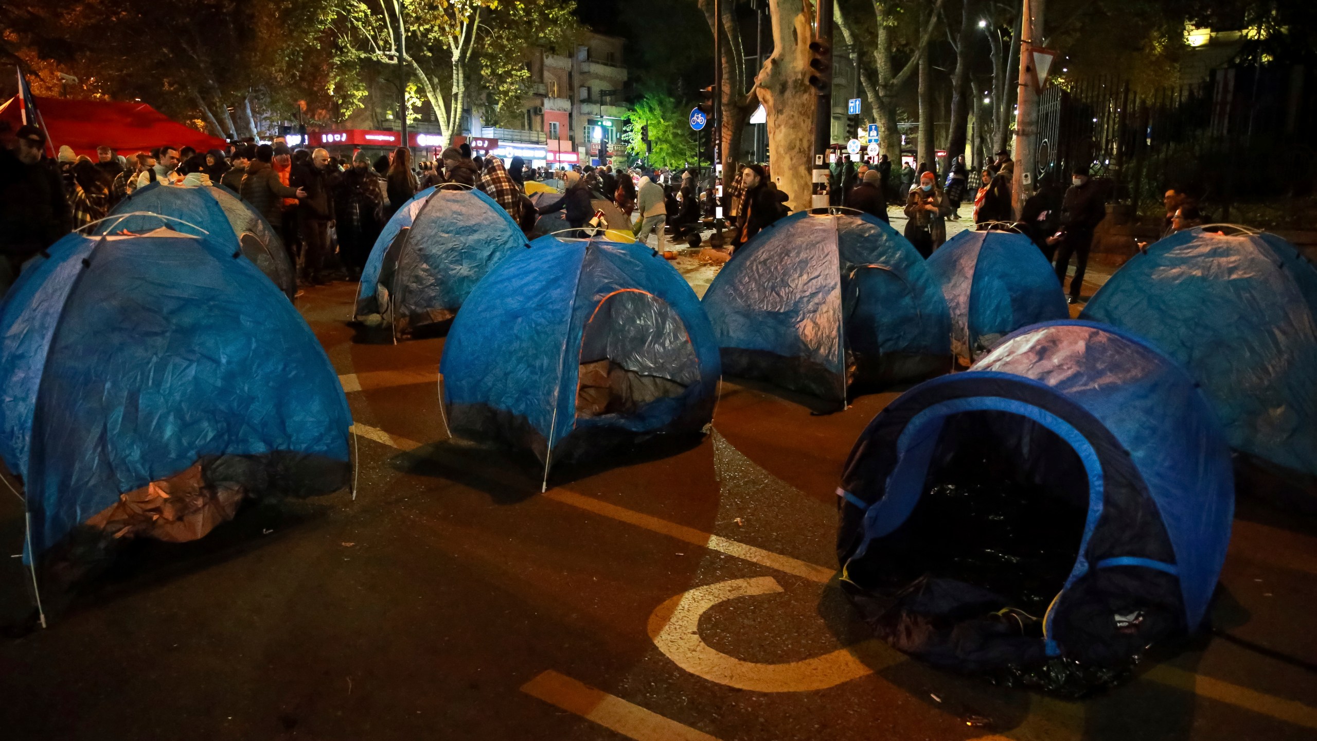 Protesters' tents are seen in a street during a rally against the results of the parliamentary elections amid allegations that the vote was rigged in Tbilisi, Georgia, early Monday, Nov. 18, 2024. (AP Photo/Zurab Tsertsvadze)