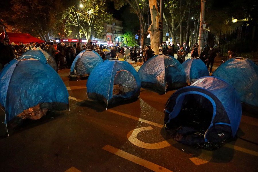 Protesters' tents are seen in a street during a rally against the results of the parliamentary elections amid allegations that the vote was rigged in Tbilisi, Georgia, early Monday, Nov. 18, 2024. (AP Photo/Zurab Tsertsvadze)