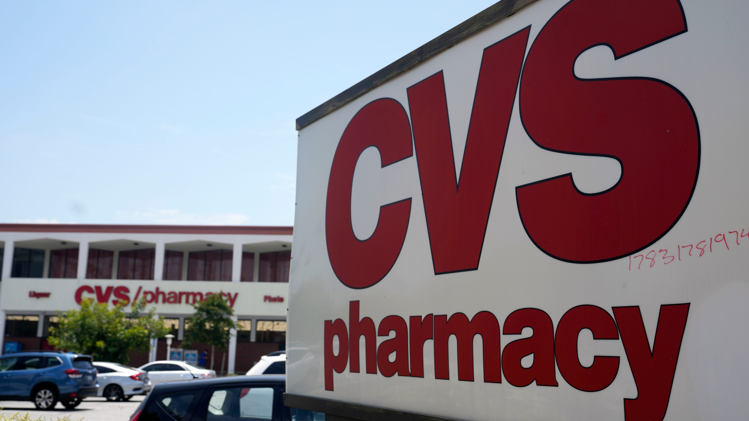 FILE - A sign marks a CVS branch on Tuesday, May 16, 2023, in Pasadena, Calif. (AP Photo/Marcio Jose Sanchez, File)