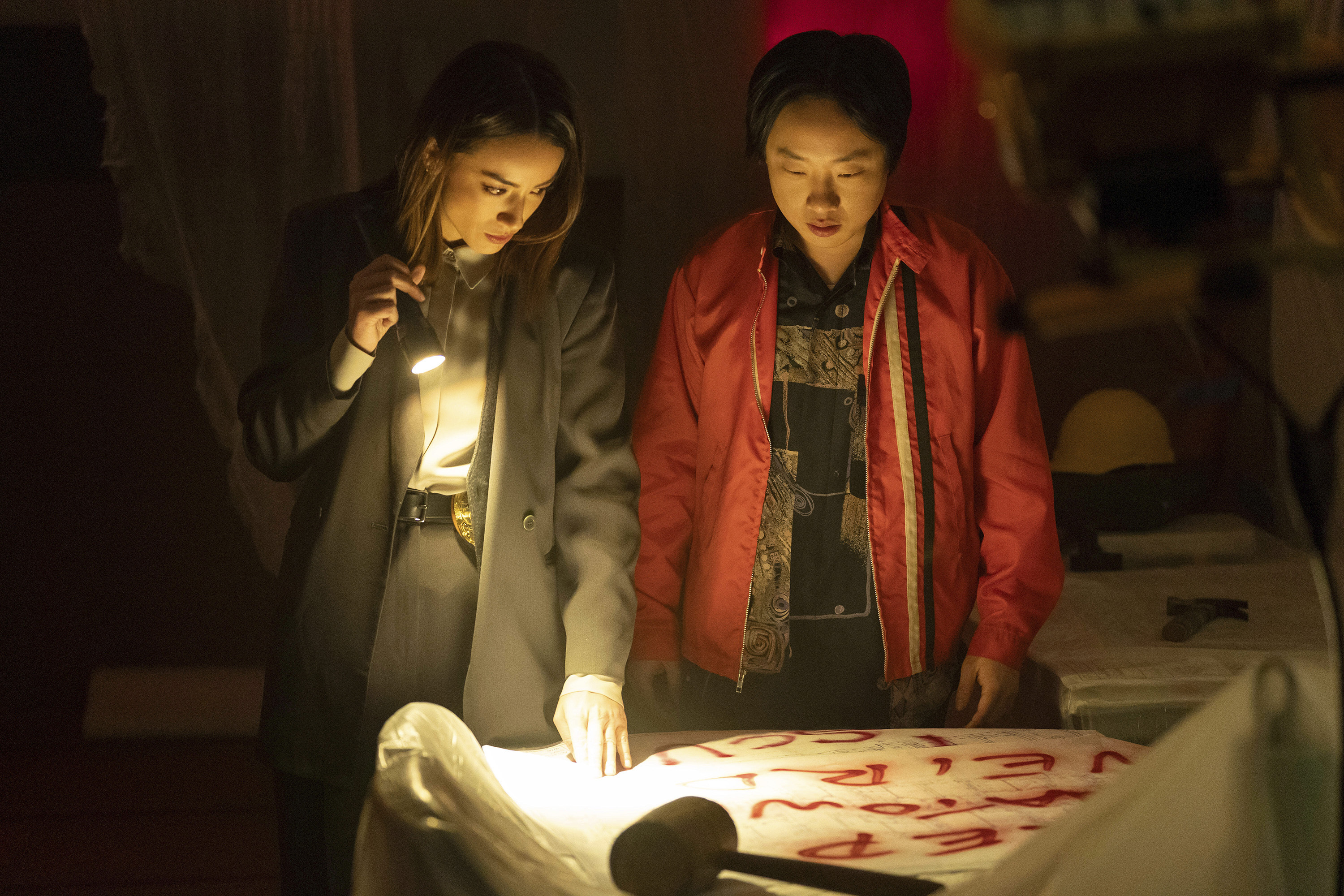 This image released by Hulu shows Chloe Bennet, left, and Jimmy O. Yang in a scene from the series "Interior Chinatown." (Mike Taing/Hulu via AP)