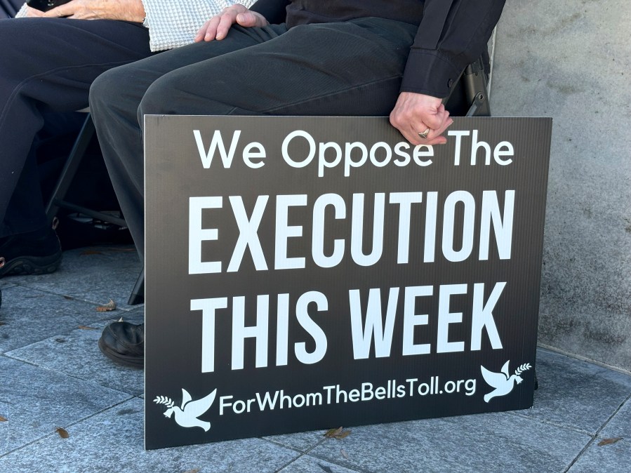 A demonstrator holds a sign during a protest outside the Capitol in Montgomery, Ala., on Monday, Nov. 18, 2024, against a scheduled execution in Alabama using nitrogen gas. (Kim Chandler/Associated Press)