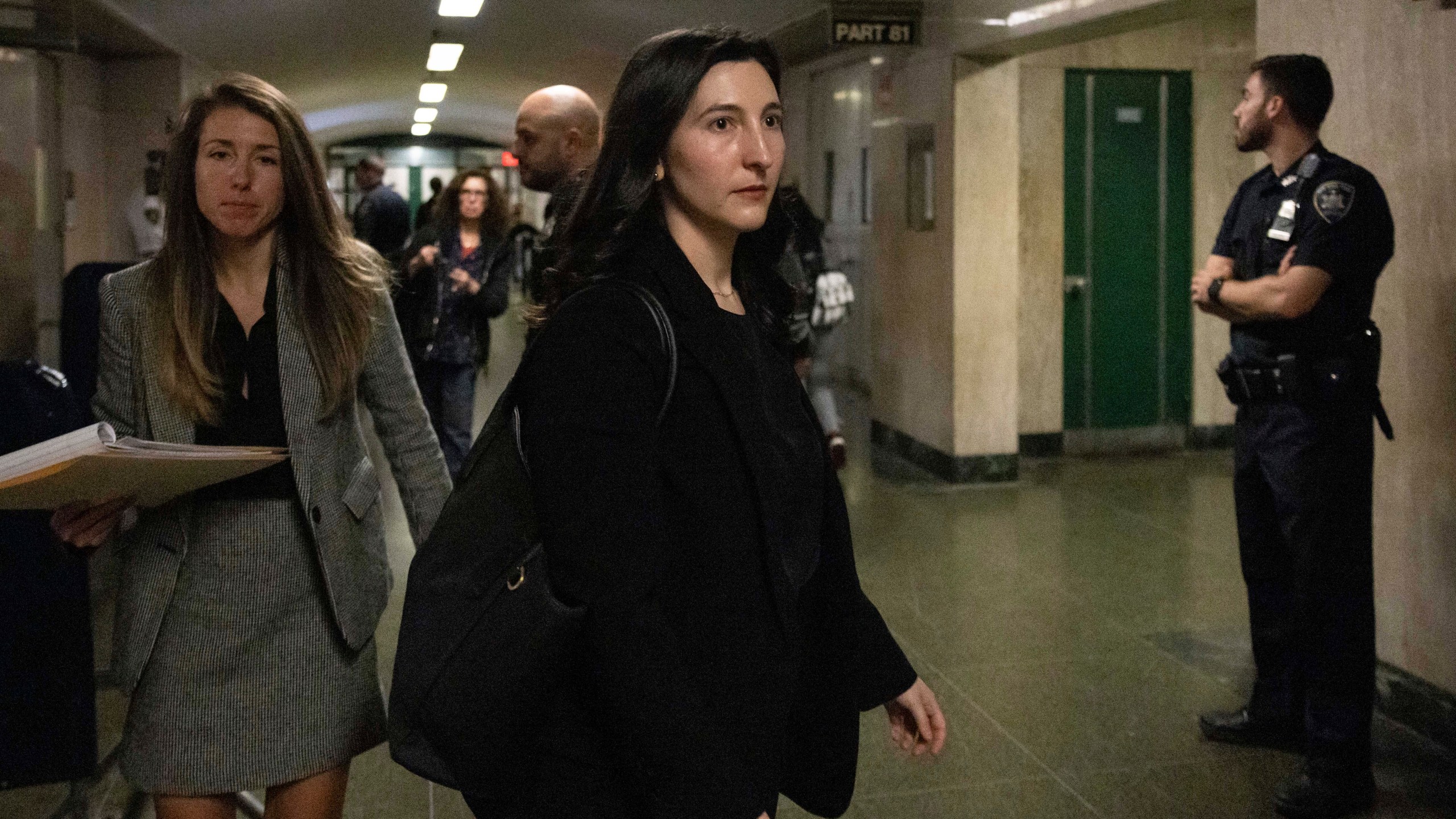 Dr. Cynthia Harris, forensic pathologist at the Office of the City Medical Examiner, leaves the courtroom for a lunch break in New York, Monday, Nov. 18, 2024. (AP Photo/Yuki Iwamura)