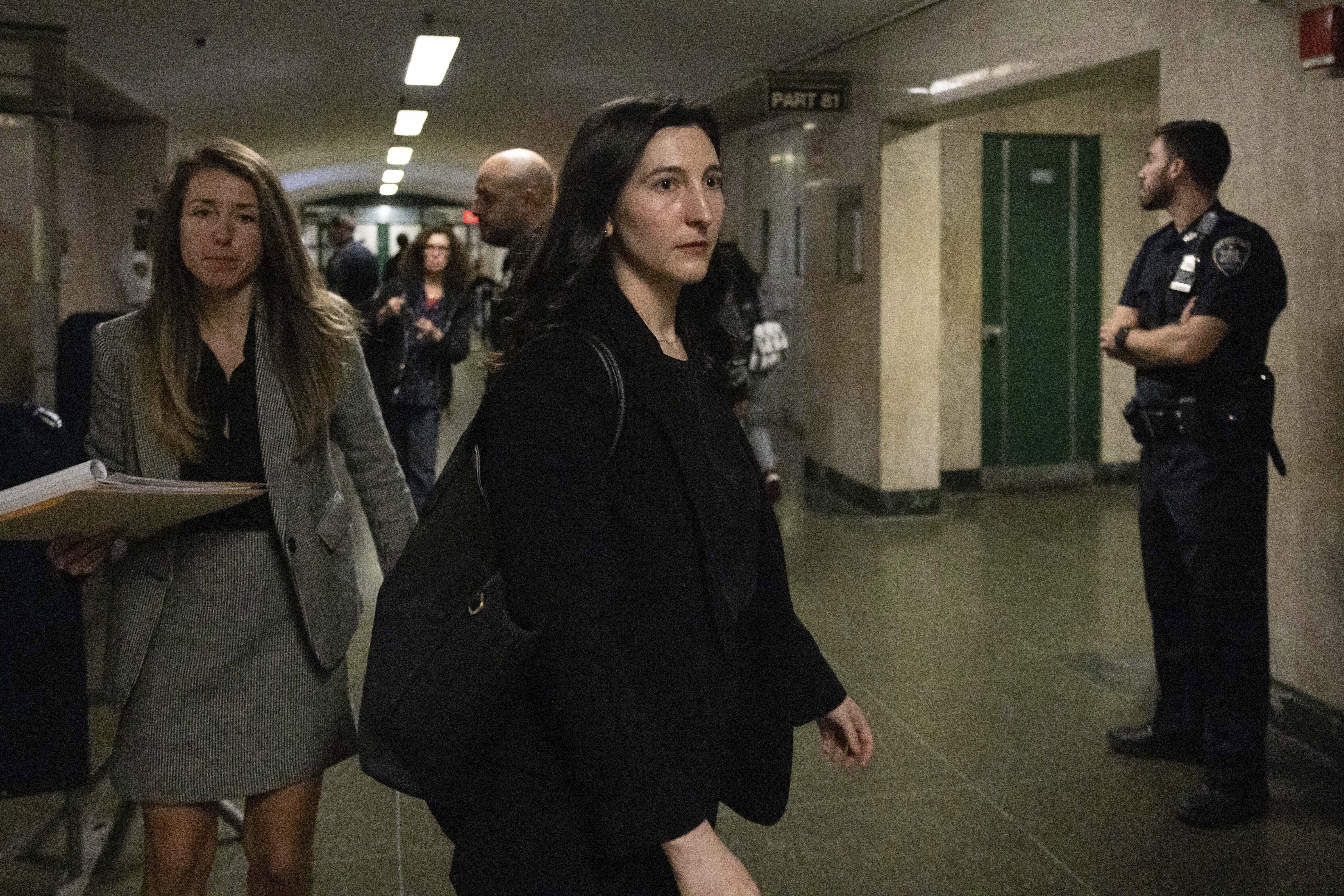 Dr. Cynthia Harris, forensic pathologist at the Office of the City Medical Examiner, leaves the courtroom for a lunch break in New York, Monday, Nov. 18, 2024. (AP Photo/Yuki Iwamura)