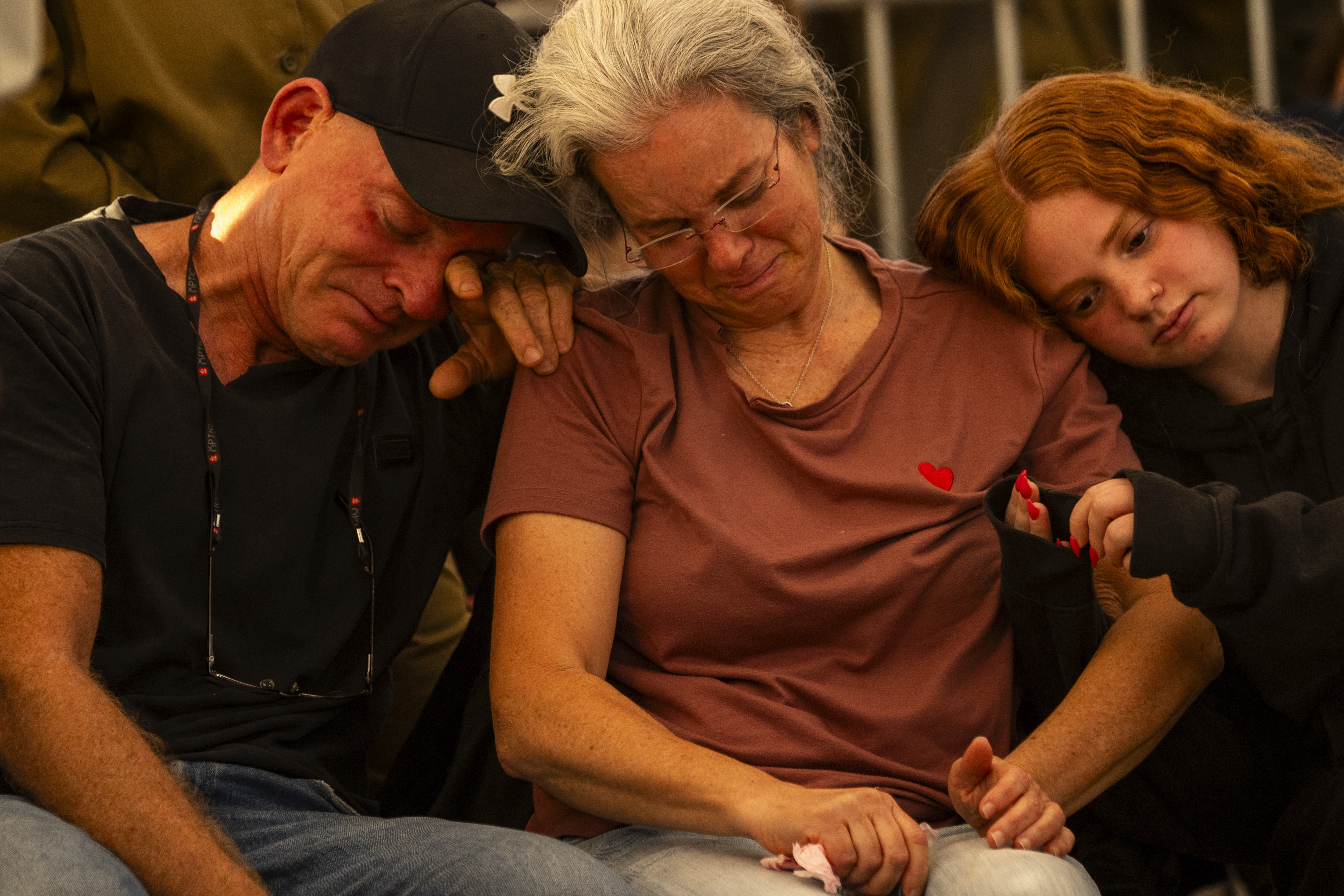 Relatives of Israel Defense Force captain Yogev Pazi, who was killed in Gaza, mourn during his funeral at the cemetery of Giv'ot Bar, southern Israel, Monday, Nov. 18, 2024. (AP Photo/Francisco Seco)