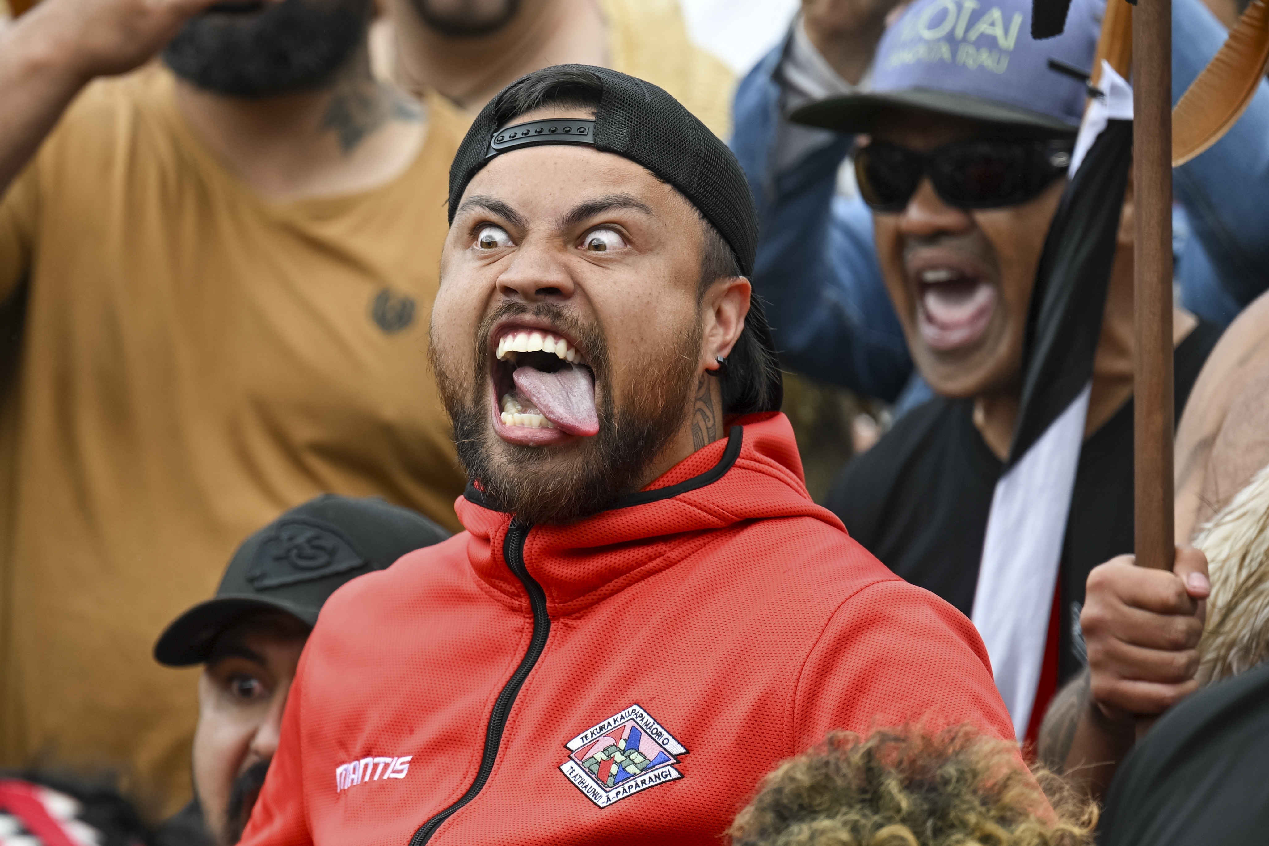 A protester reacts outside New Zealand's parliament during a demonstration against a proposed law that would redefine the country's founding agreement between Indigenous Māori and the British Crown, in Wellington Tuesday, Nov. 19, 2024. (AP Photo/Mark Tantrum)