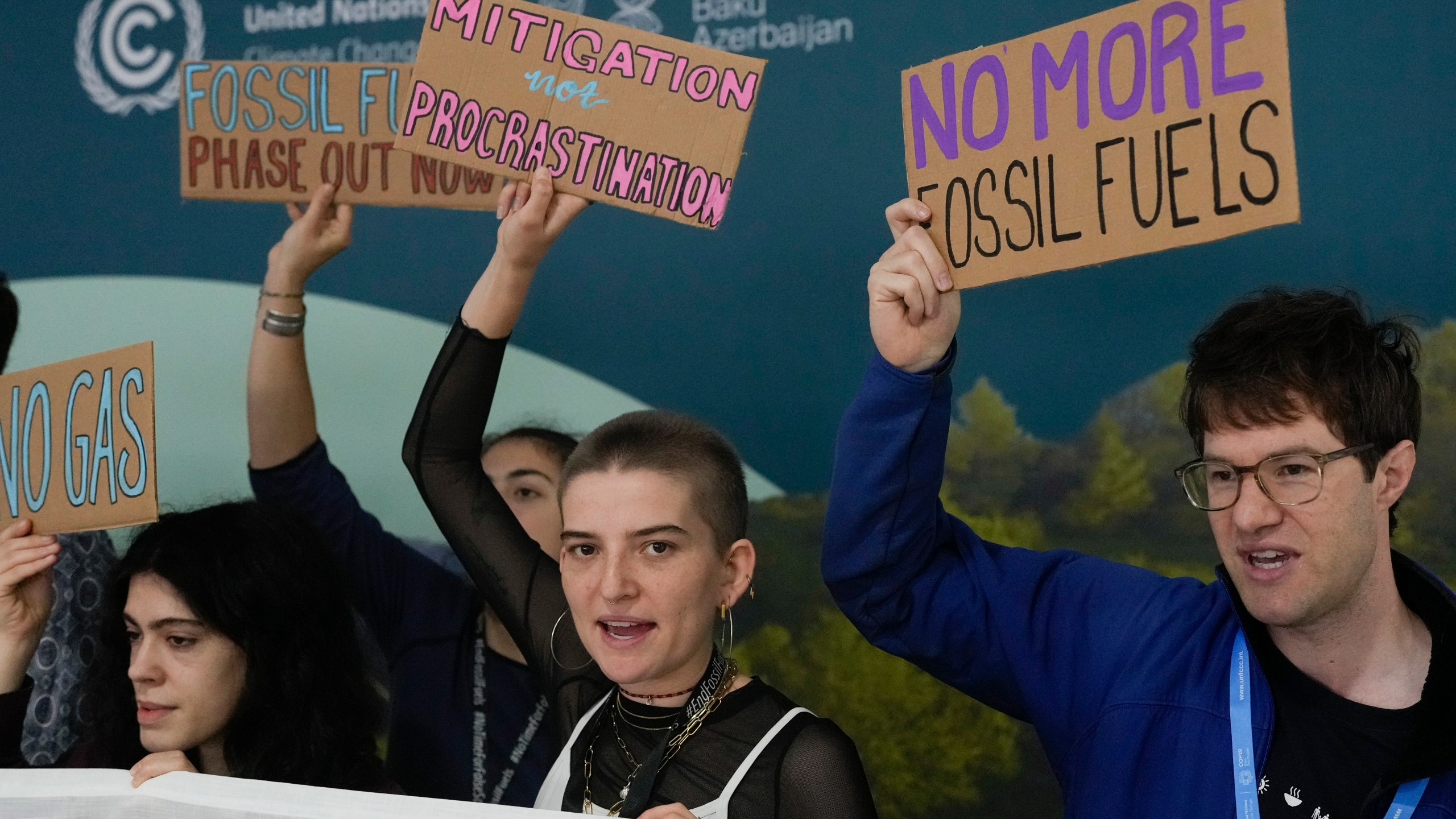 Activists participate in a demonstration against fossil fuels at the COP29 U.N. Climate Summit, Tuesday, Nov. 19, 2024, in Baku, Azerbaijan. (AP Photo/Rafiq Maqbool)