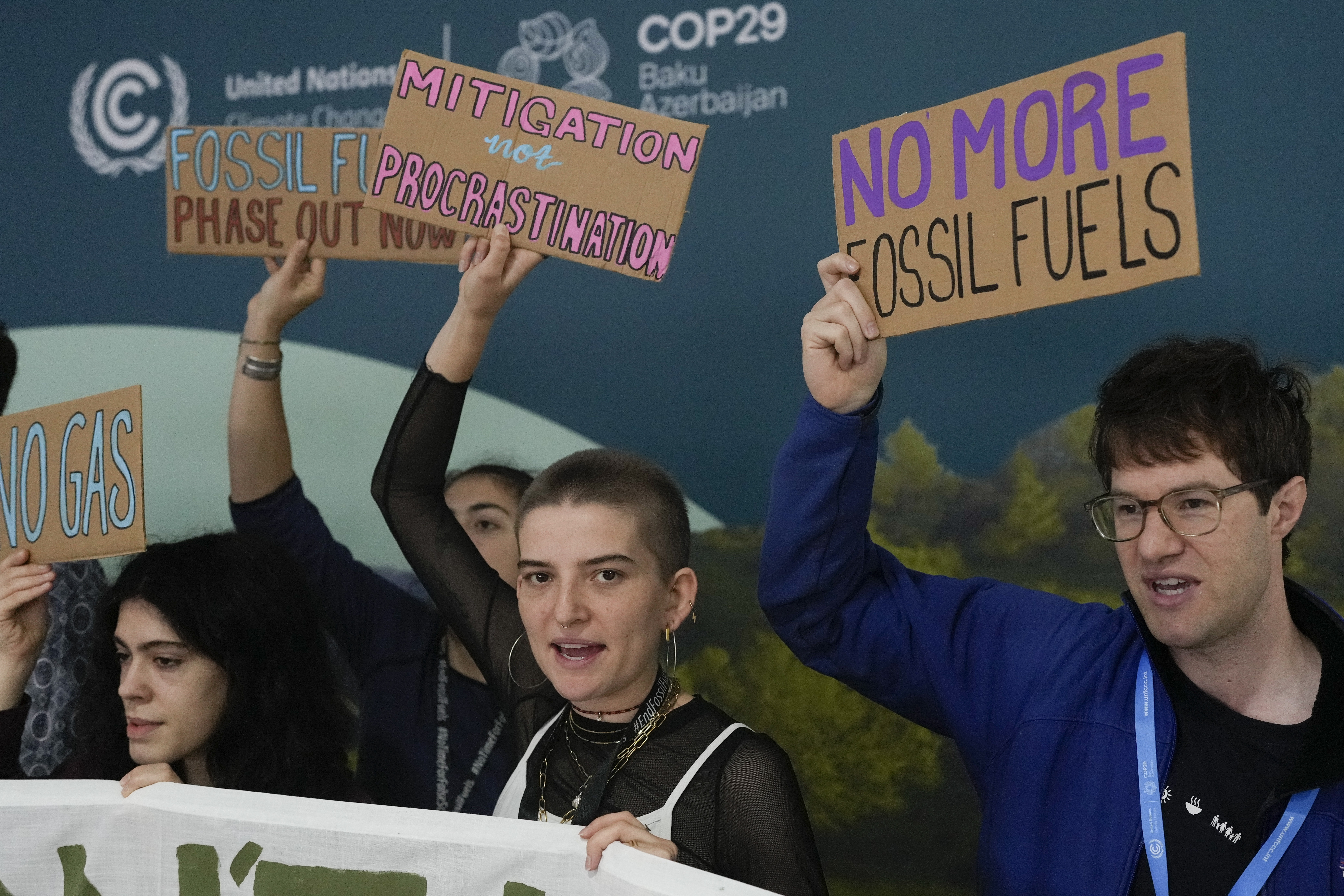 Activists participate in a demonstration against fossil fuels at the COP29 U.N. Climate Summit, Tuesday, Nov. 19, 2024, in Baku, Azerbaijan. (AP Photo/Rafiq Maqbool)