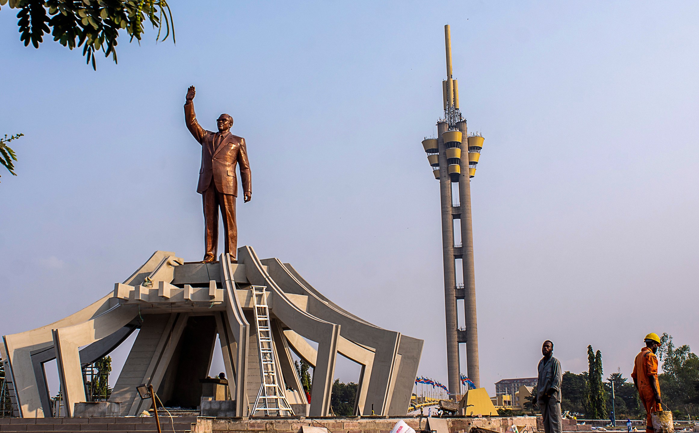 FILE - Workers stand by a memorial for Democratic Republic of the Congo independence hero Patrice Lumumba, in Kinshasa, Congo, June 20, 2022. (AP Photo/Samy Ntumba Shambuyi, File)