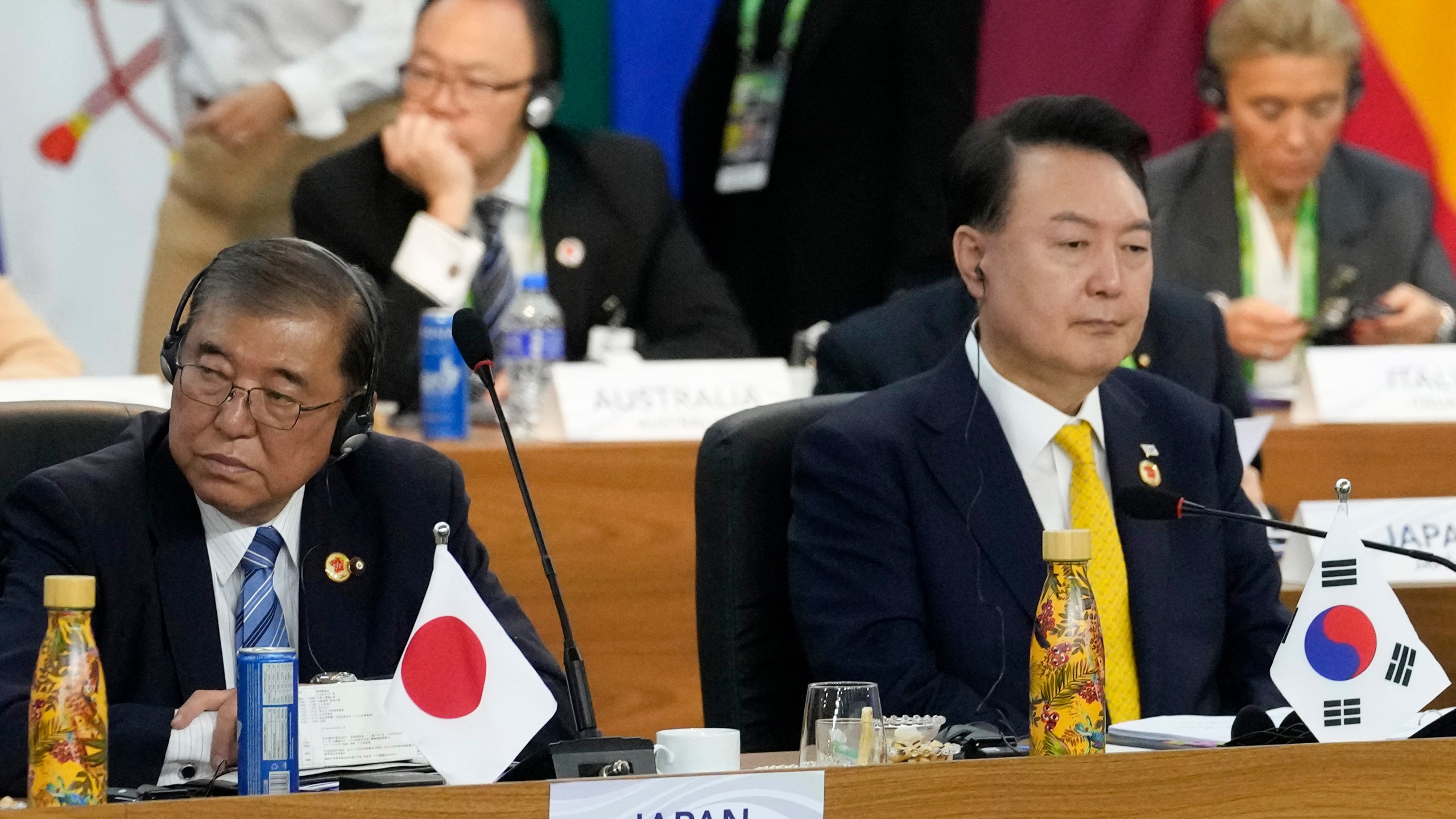 Japan's Prime Minister Shigeru Ishiba, left, and South Korea's President Yoon Suk Yeol attend the G20 Summit leaders meeting in Rio de Janeiro, Monday, Nov. 18, 2024. (AP Photo/Eraldo Peres)