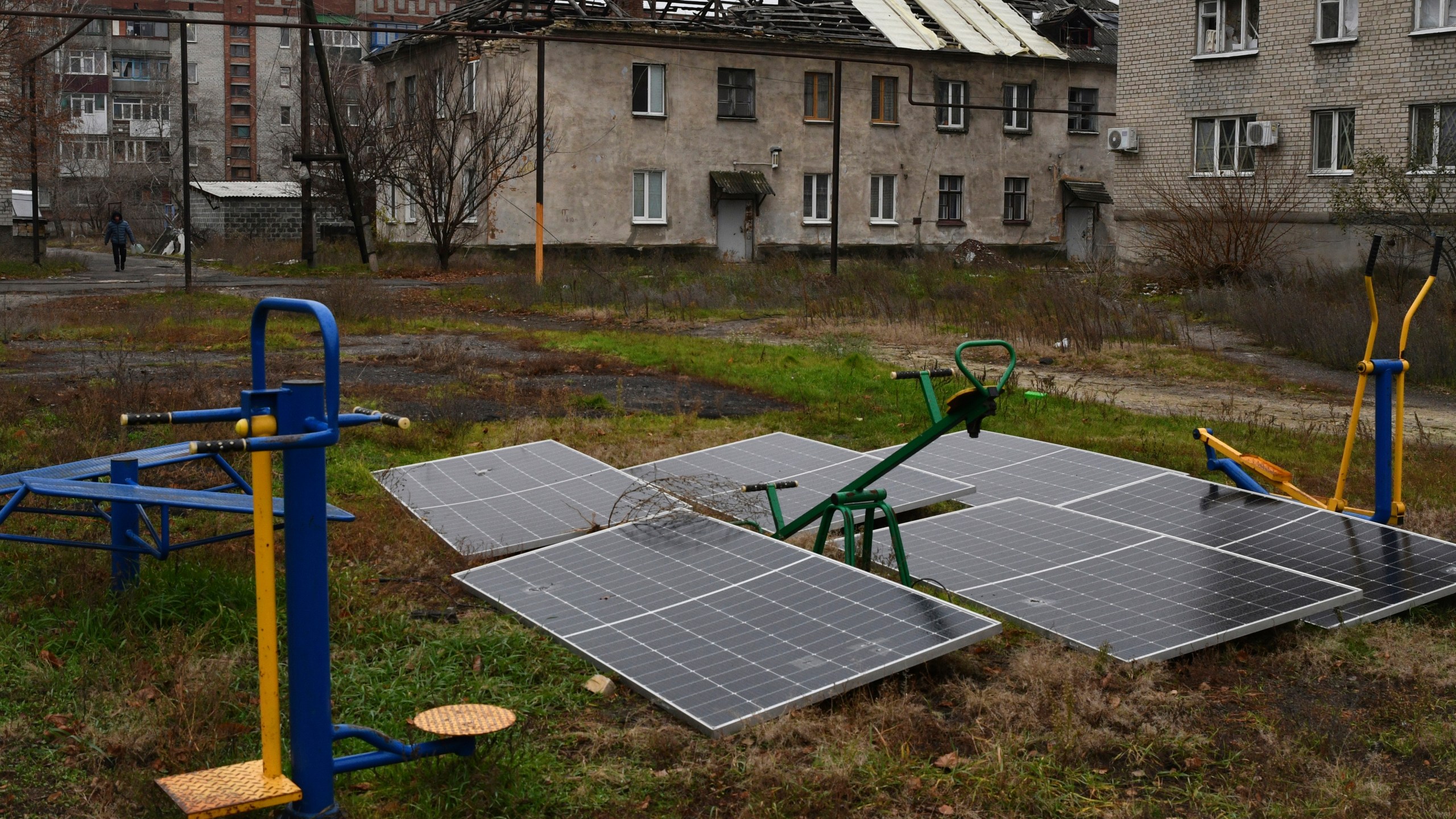 FILE - Solar panels sit in the yard of an apartment building in Lyman, Donetsk region, Ukraine, Nov. 20, 2022. (AP Photo/Andriy Andriyenko, File)