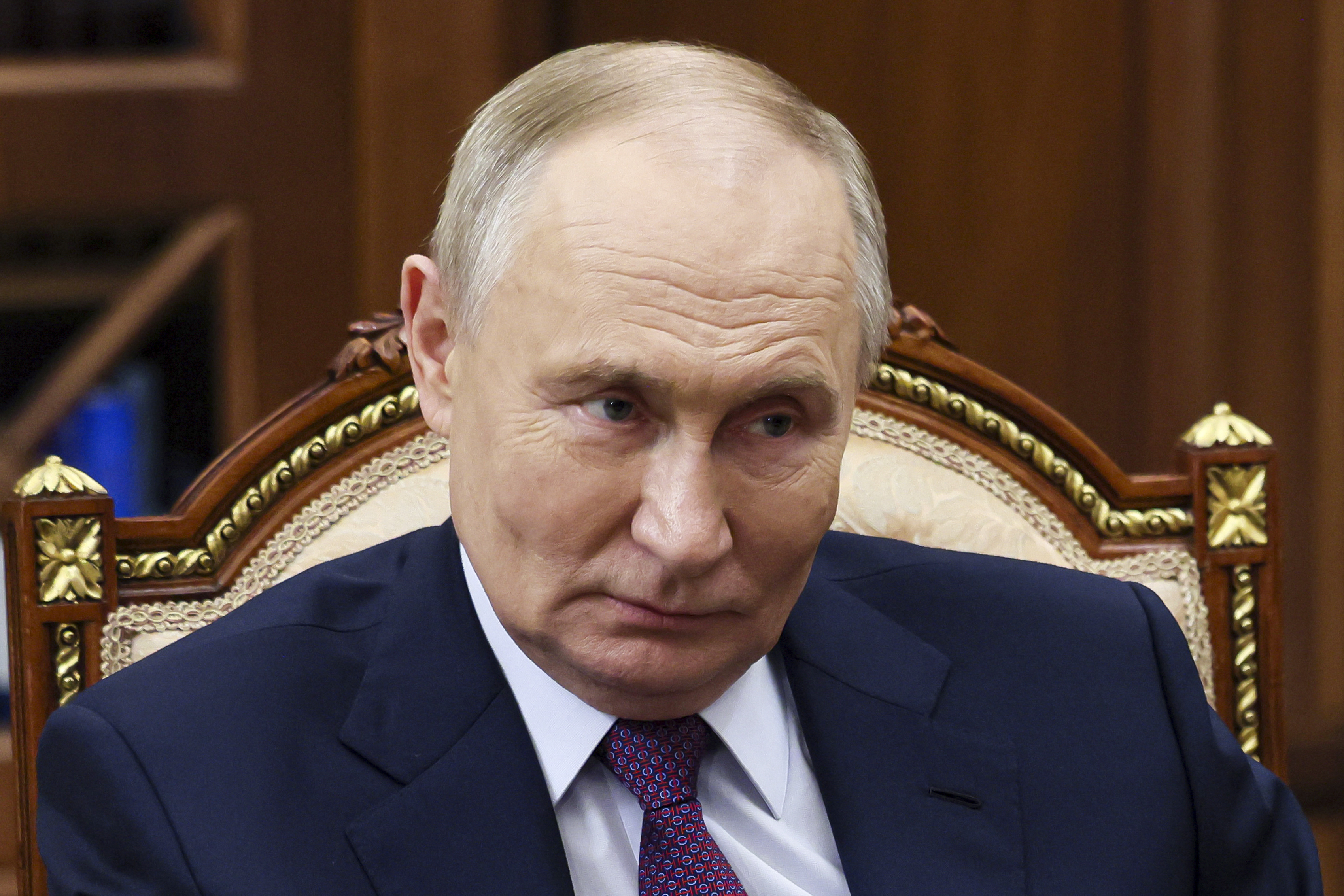 Russian President Vladimir Putin listens to New People party's leader Alexey Nechaev during their meeting at the Kremlin in Moscow, Russia, Tuesday, Nov. 19, 2024. (Vyacheslav Prokofyev, Sputnik, Kremlin Pool Photo via AP)