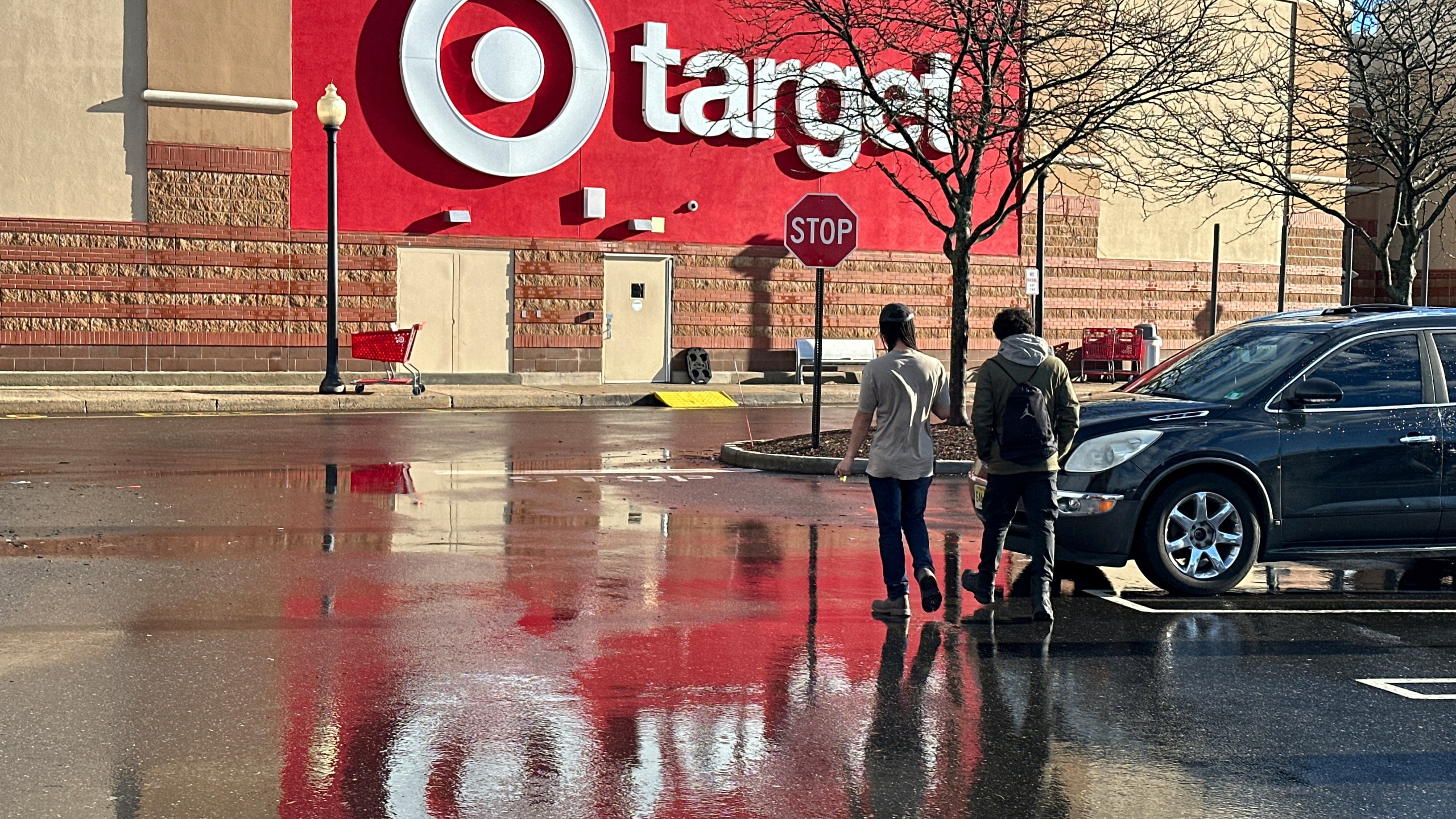 FILE - People walk towards a Target store in Clifton, N.J., on December 18, 2023. (AP Photo/Ted Shaffrey, File)