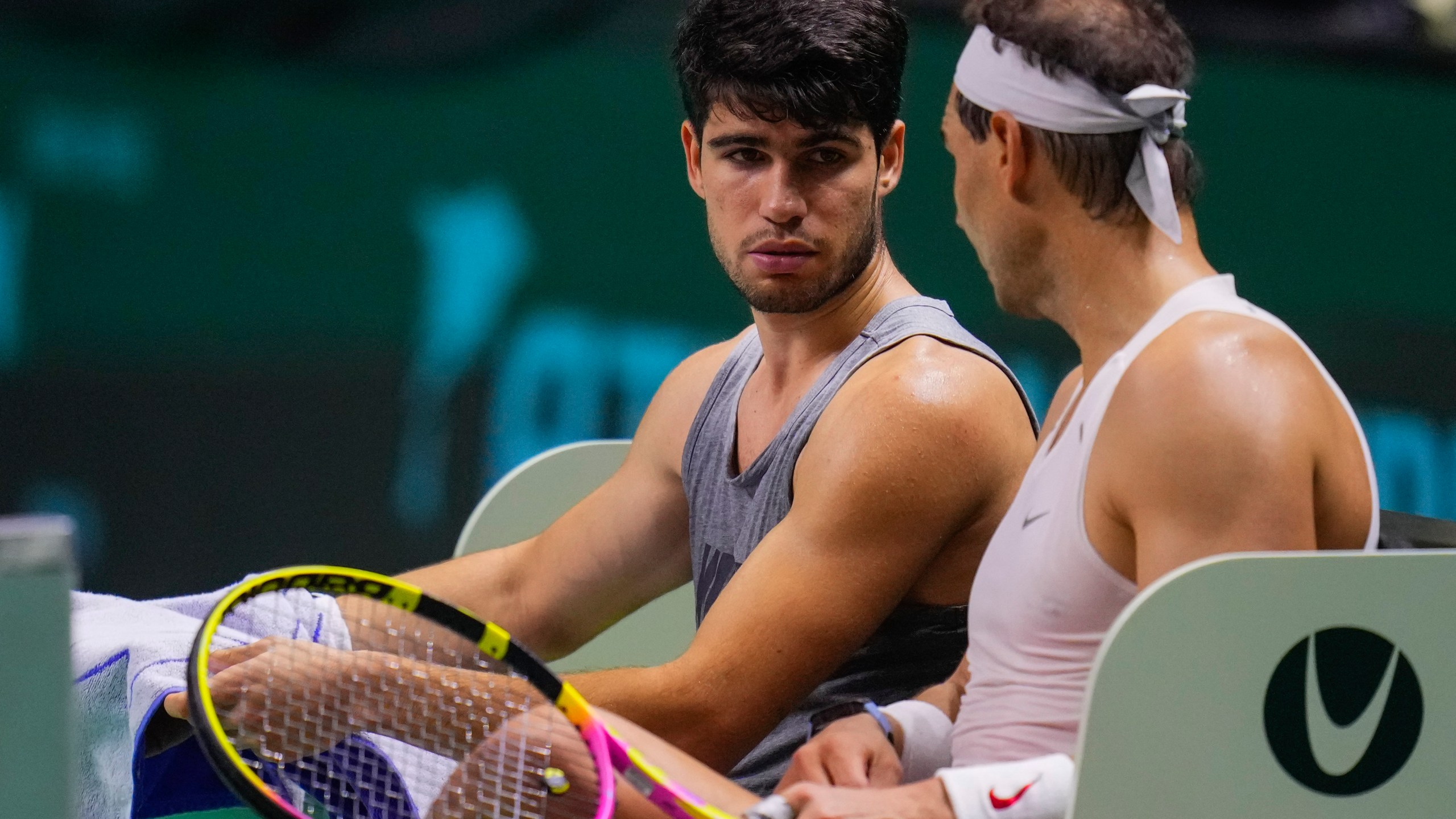 Spain's tennis players Carlos Alcaraz, left, and Rafael Nadal attend a training session in Malaga, southern Spain, on Monday, Nov. 18, 2024. (AP Photo/Manu Fernandez)