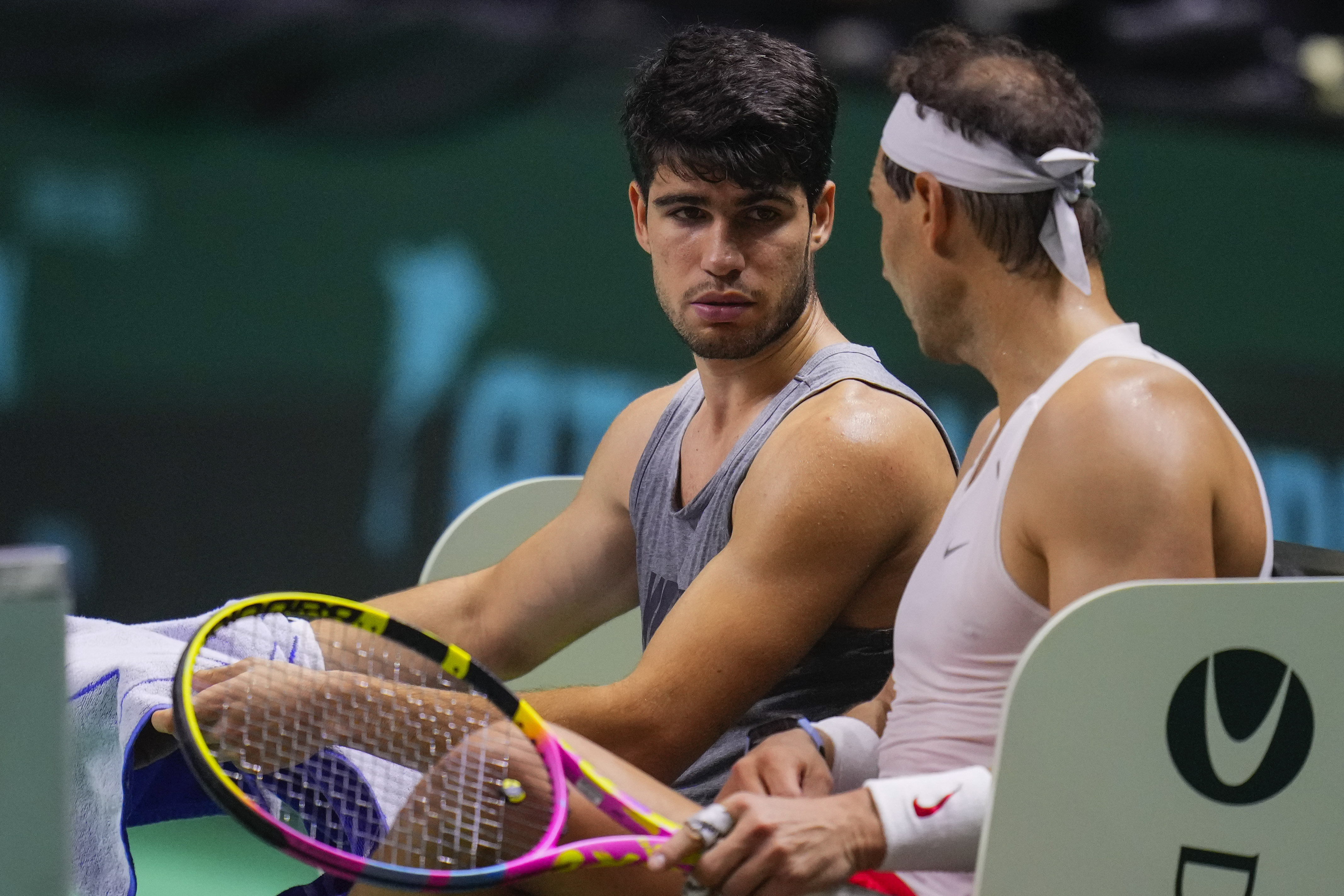 Spain's tennis players Carlos Alcaraz, left, and Rafael Nadal attend a training session in Malaga, southern Spain, on Monday, Nov. 18, 2024. (AP Photo/Manu Fernandez)