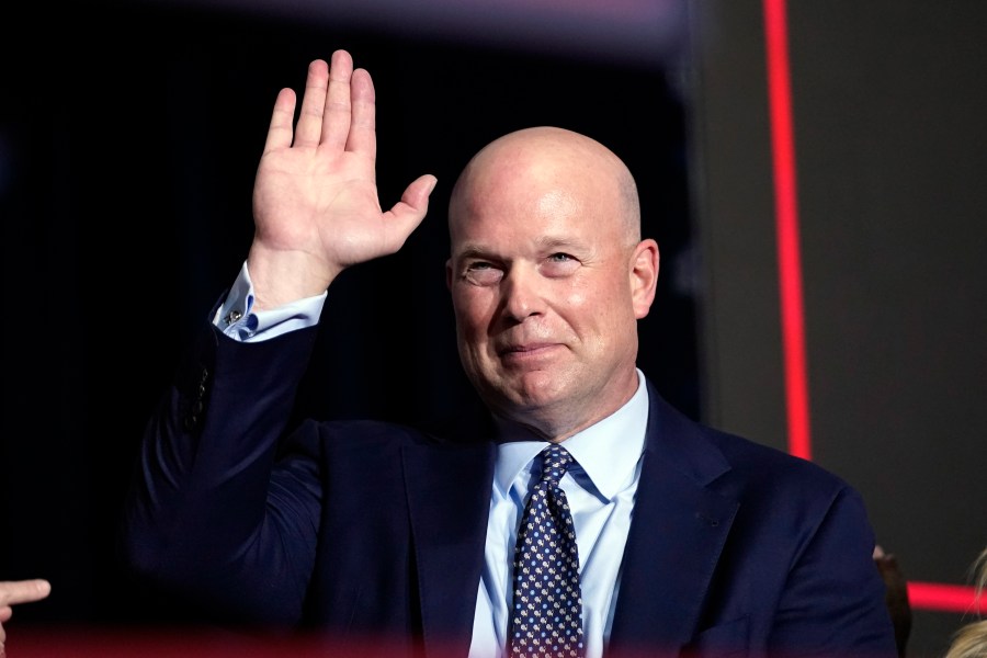 FILE - Former acting Attorney General Matt Whitaker waves as Republican presidential candidate former President Donald Trump speaks at a caucus night party in Des Moines, Iowa, Jan. 15, 2024. (AP Photo/Andrew Harnik, File)