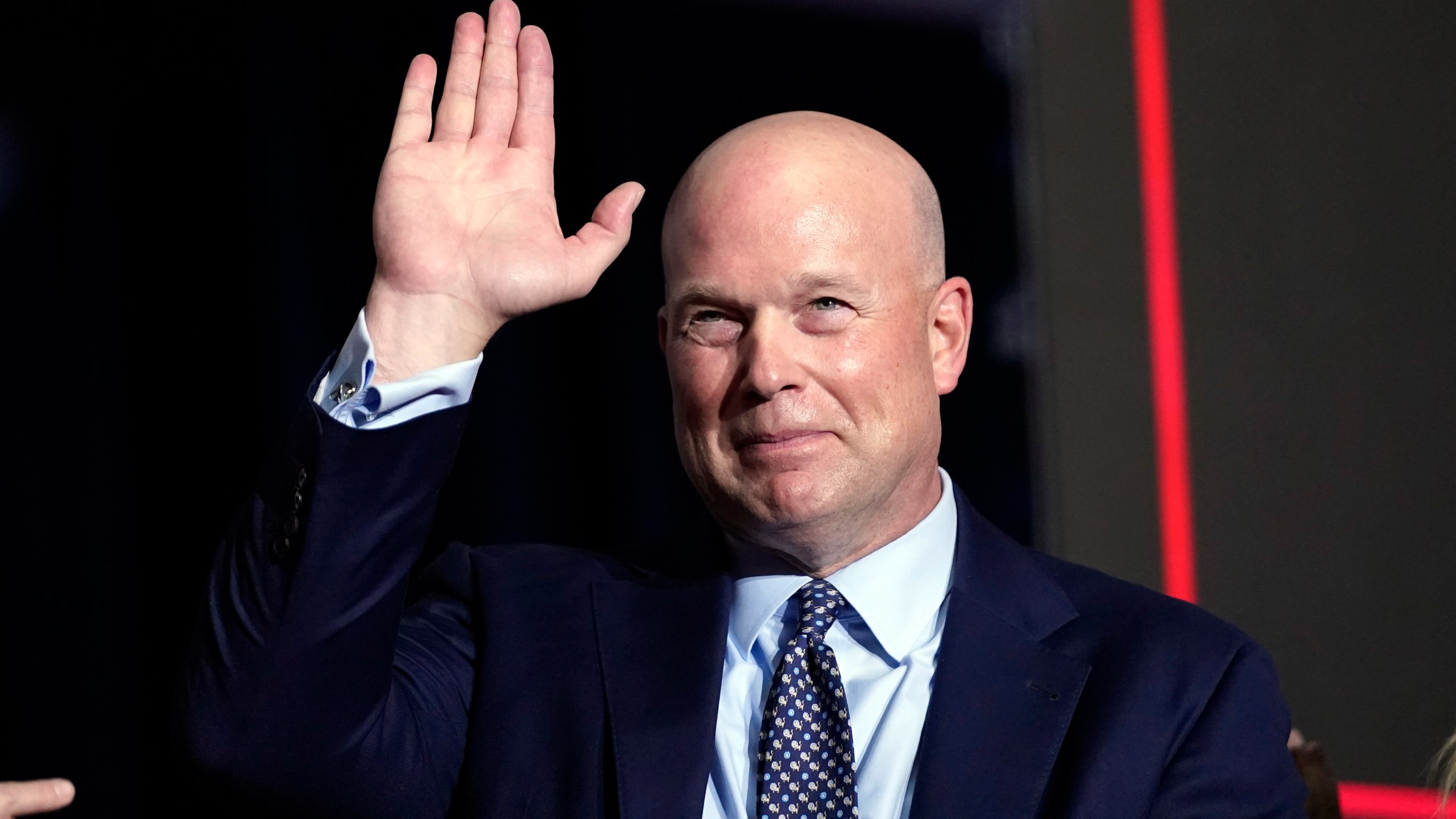 FILE - Former acting Attorney General Matt Whitaker waves as Republican presidential candidate former President Donald Trump speaks at a caucus night party in Des Moines, Iowa, Jan. 15, 2024. (AP Photo/Andrew Harnik, File)