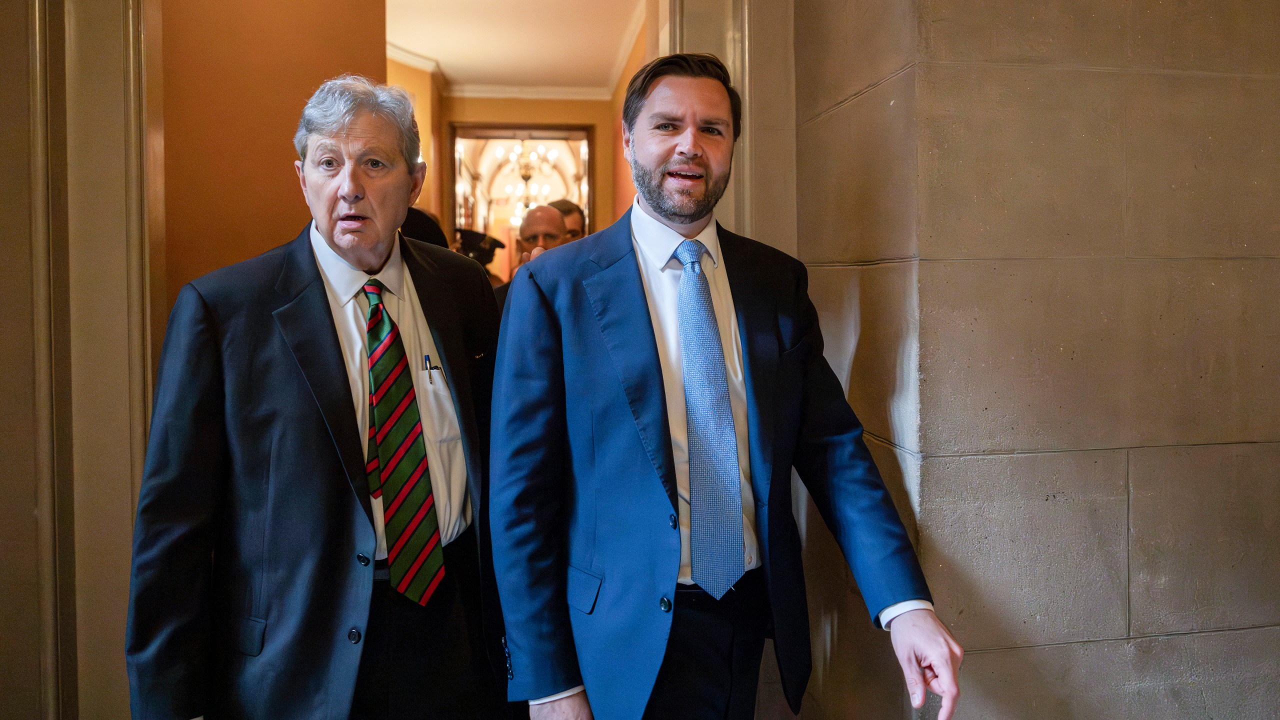 Vice President-elect JD Vance, right, and Sen. John Kennedy, R-La., left, walk out of a meeting with President-elect Donald Trump's nominee to be attorney general, former Rep. Matt Gaetz, R-Fla., and Republican Senate Judiciary Committee members, at the Capitol in Washington, Wednesday, Nov. 20, 2024. (AP Photo/Ben Curtis)