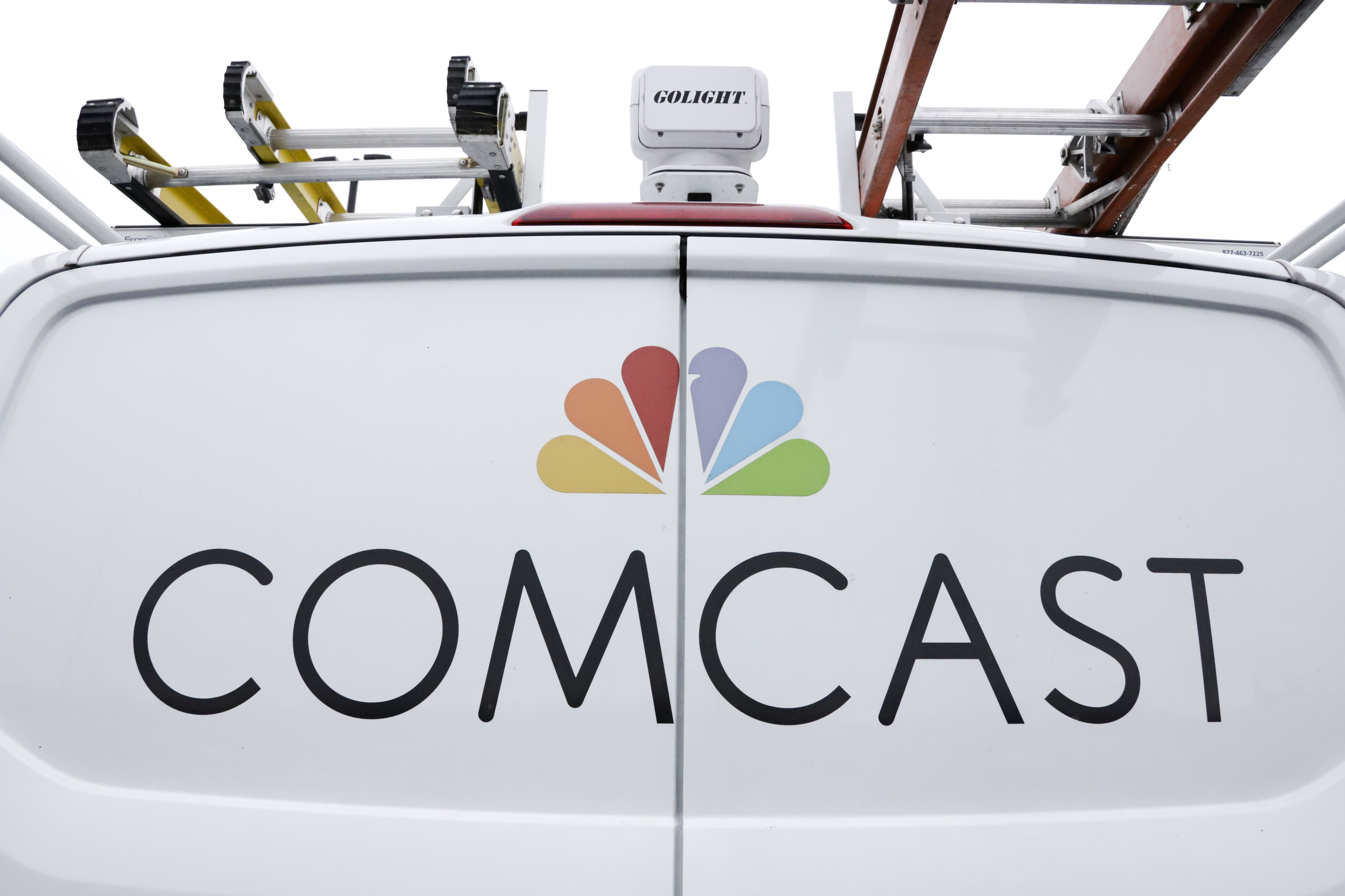 FILE- A Comcast truck is shown on Jan. 24, 2019, in Pittsburgh. (AP Photo/Gene J. Puskar, File)