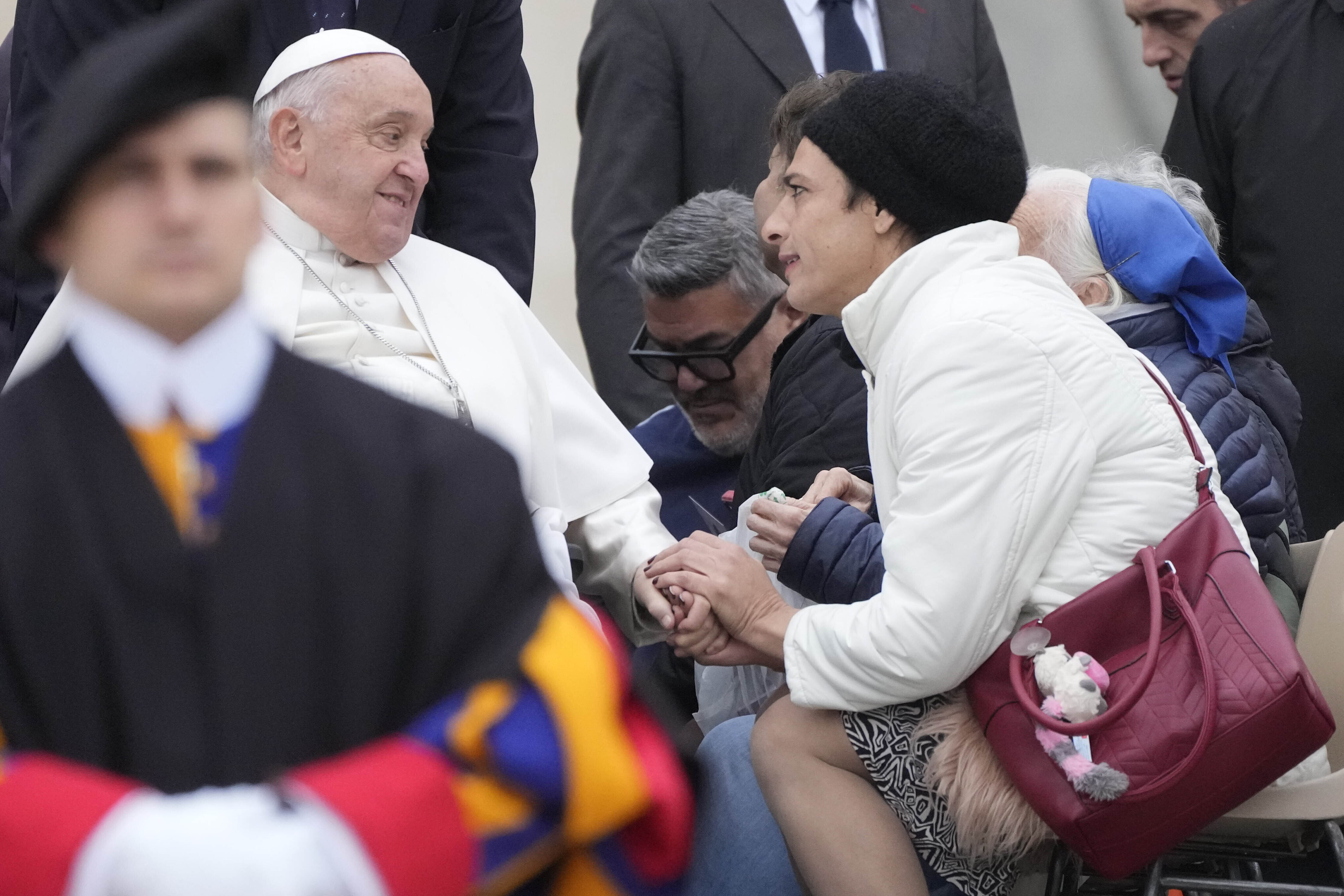 Pope Francis greets faithful during his weekly general audience in St. Peter's Square at The Vatican, Wednesday, Nov.20, 2024. (AP Photo/Gregorio Borgia)