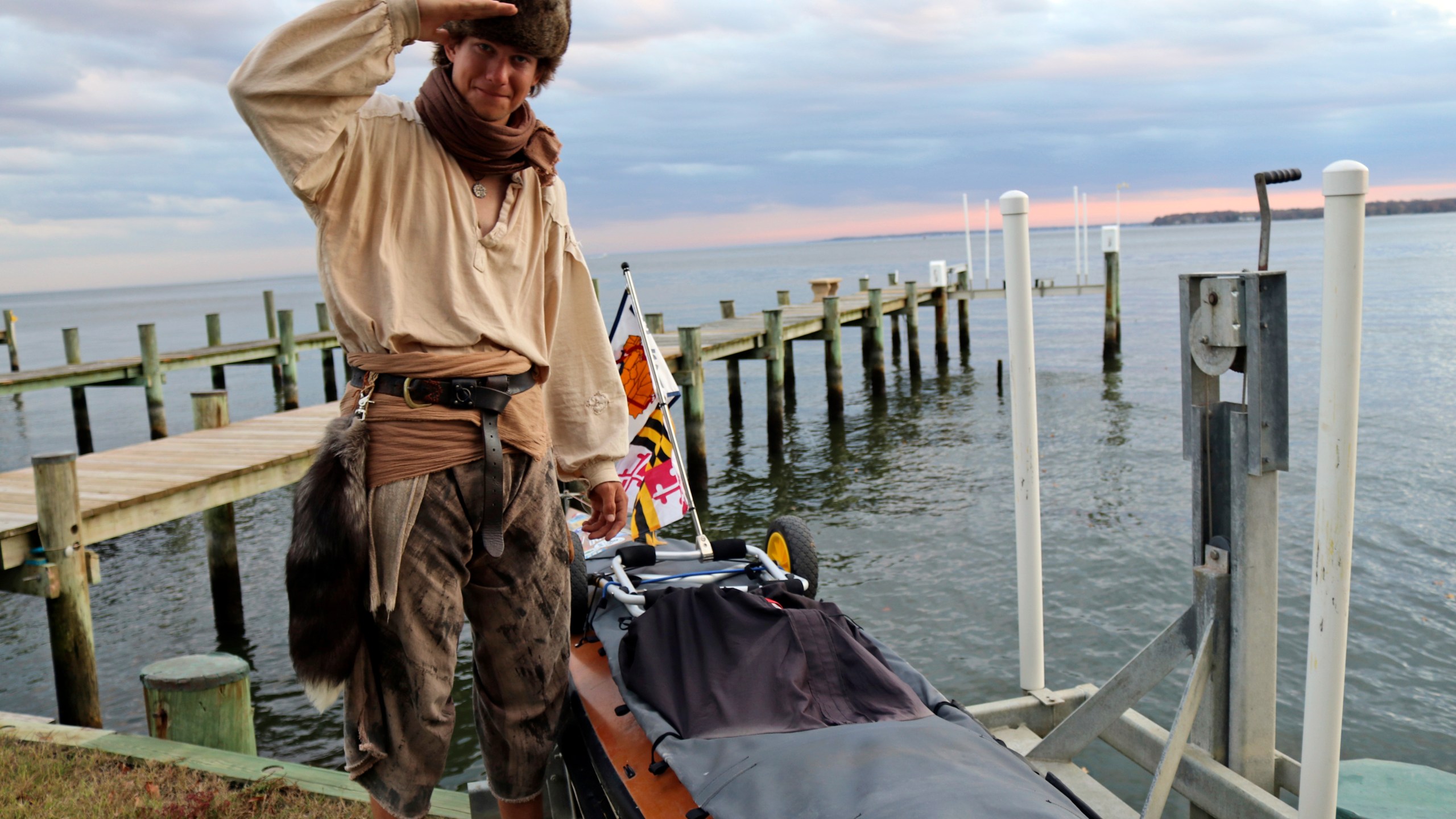 Peter Frank stands by his canoe in Annapolis, Md., on Thursday, Nov. 7, 2024, a day before he plans to resume his trip along the Great Loop in what is roughly a 6,000-mile voyage and that he estimates will take him a total of about 17 months. (AP Photo/Brian Witte)