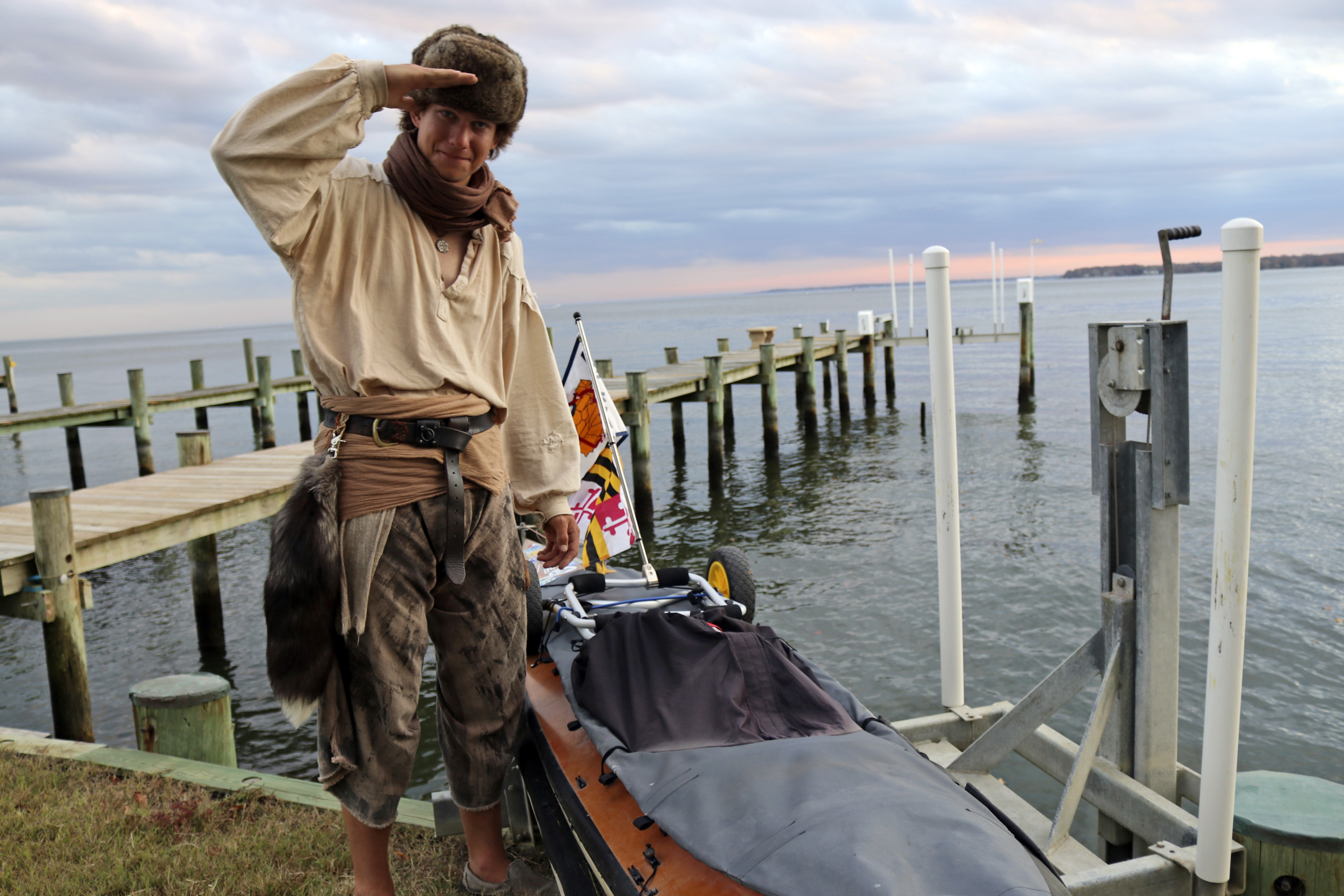 Peter Frank stands by his canoe in Annapolis, Md., on Thursday, Nov. 7, 2024, a day before he plans to resume his trip along the Great Loop in what is roughly a 6,000-mile voyage and that he estimates will take him a total of about 17 months. (AP Photo/Brian Witte)