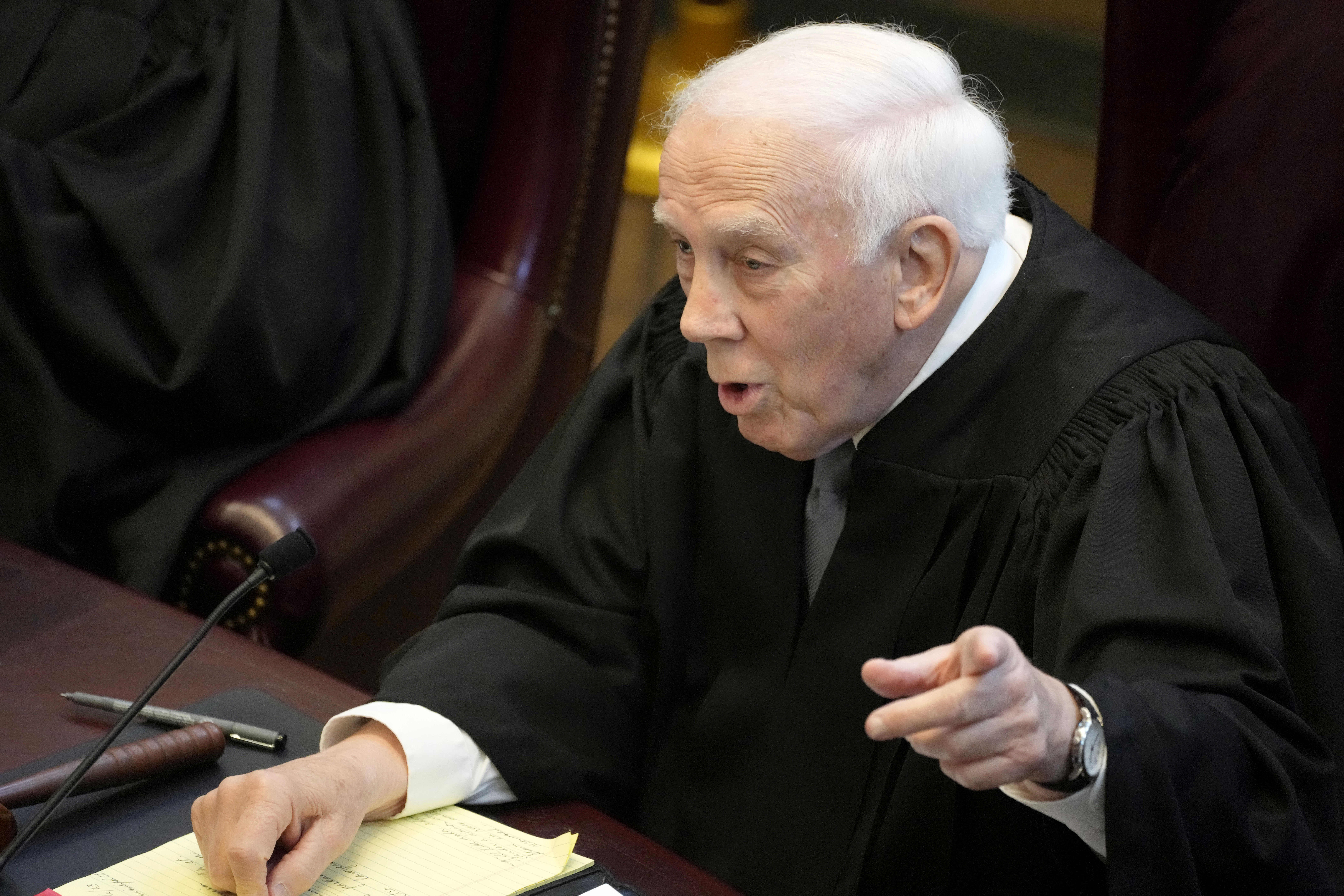 FILE - Mississippi Supreme Court Presiding Justice James W. Kitchens asks a question, July 6, 2023, before the court in Jackson, Miss. (AP Photo/Rogelio V. Solis, File)