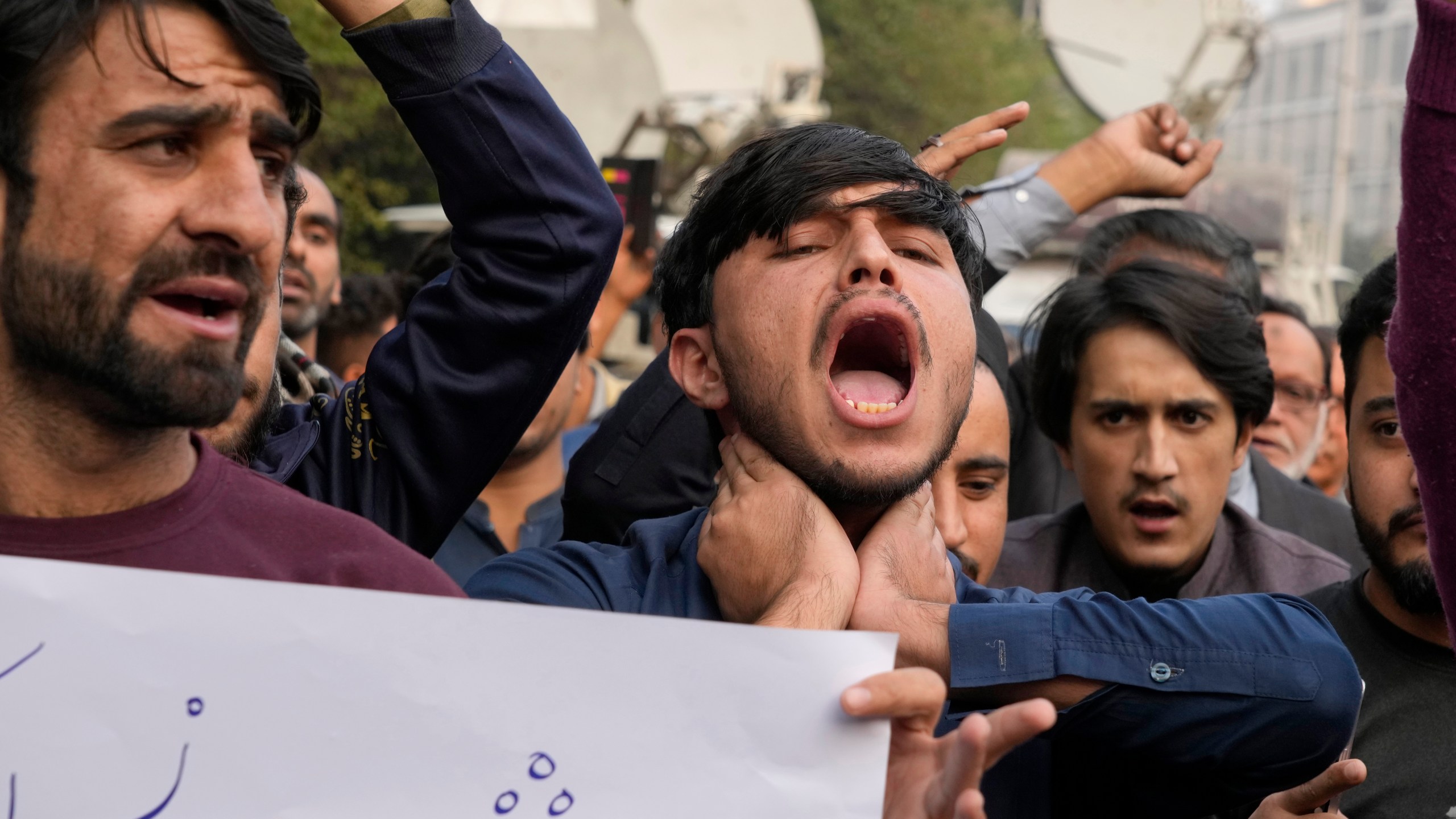 Shiite Muslims chant slogans to condemn the killing of Shiite Muslims by gunmen in an ambush in Kurram district, during a demonstration in Lahore, Pakistan, Friday, Nov. 22, 2024. (AP Photo/K.M. Chaudary)