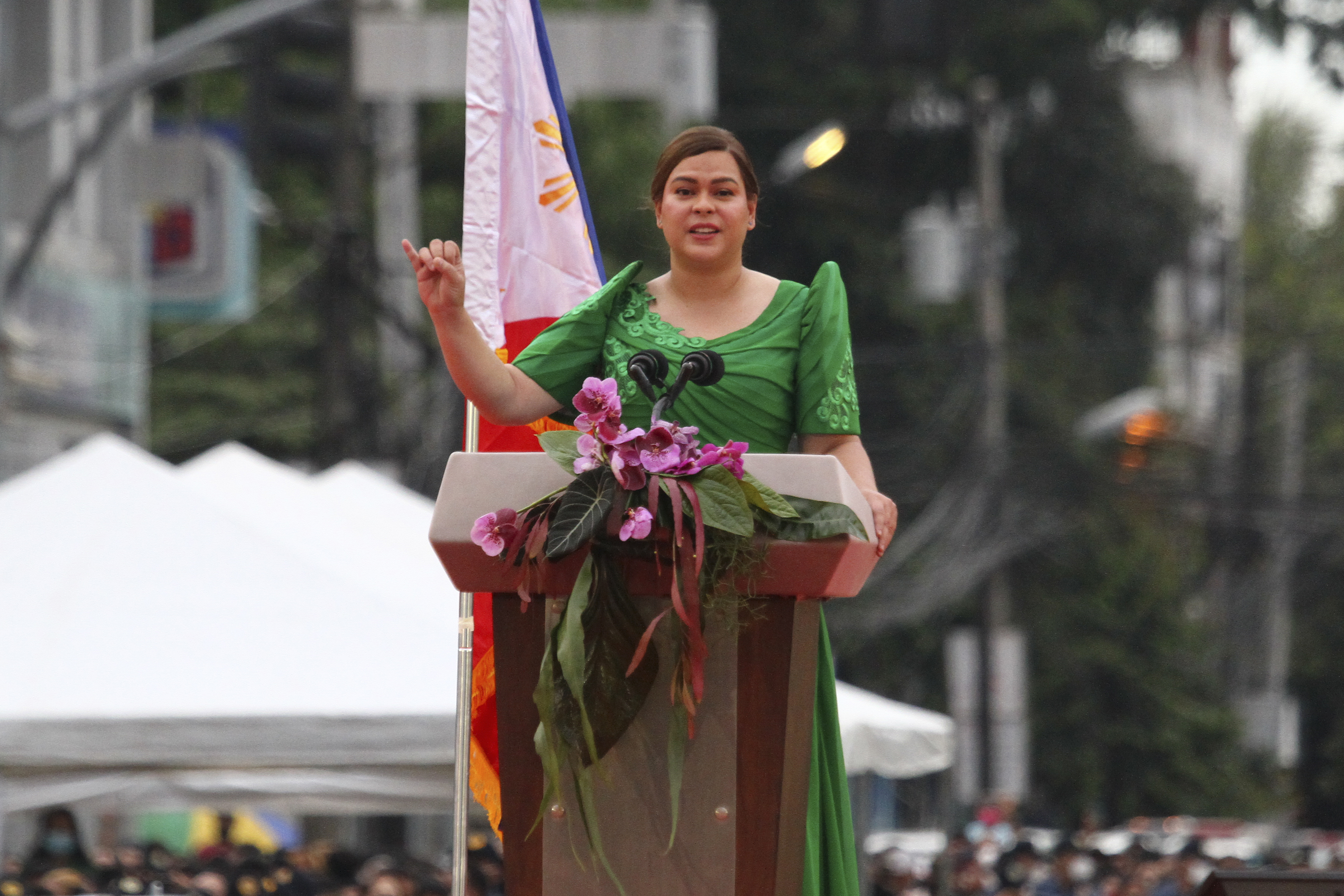 FILE - Philippine Vice President-elect Sara Duterte, daughter of outgoing populist president of the Philippines, delivers her speech during her oath-taking rites in her hometown in Davao city, southern Philippines, on June 19, 2022. (AP Photo/Manman Dejeto)