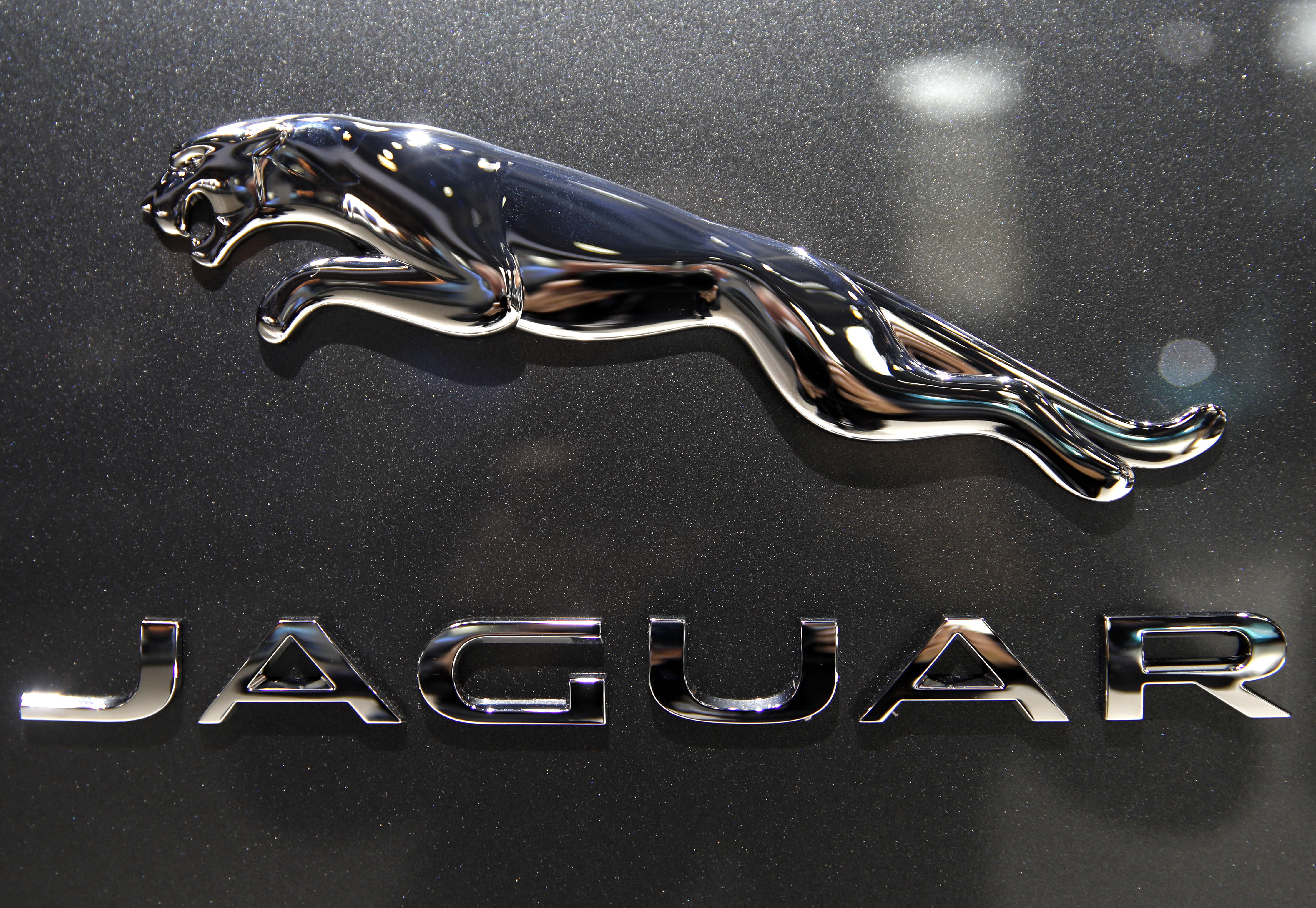 FILE - The logo of Jaguar ca is pictured at the Auto show in Paris, France, Wednesday, Oct. 3, 2018, 2018. (AP Photo/Christophe Ena, File)