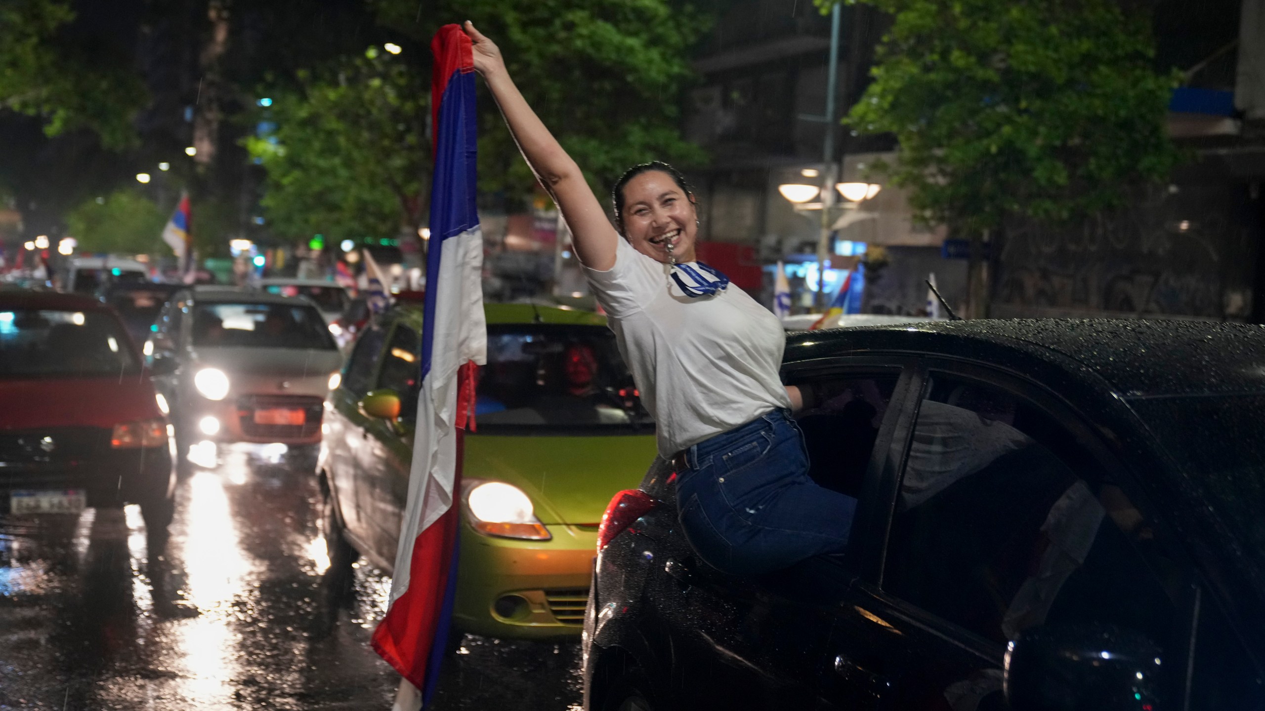 Supporters of the Broad Front (Frente Amplio) celebrate the victory of candidate Yamandú Orsi in the presidential run-off election in Montevideo, Uruguay, Sunday, Nov. 24, 2024. (AP Photo/Matilde Campodonico)