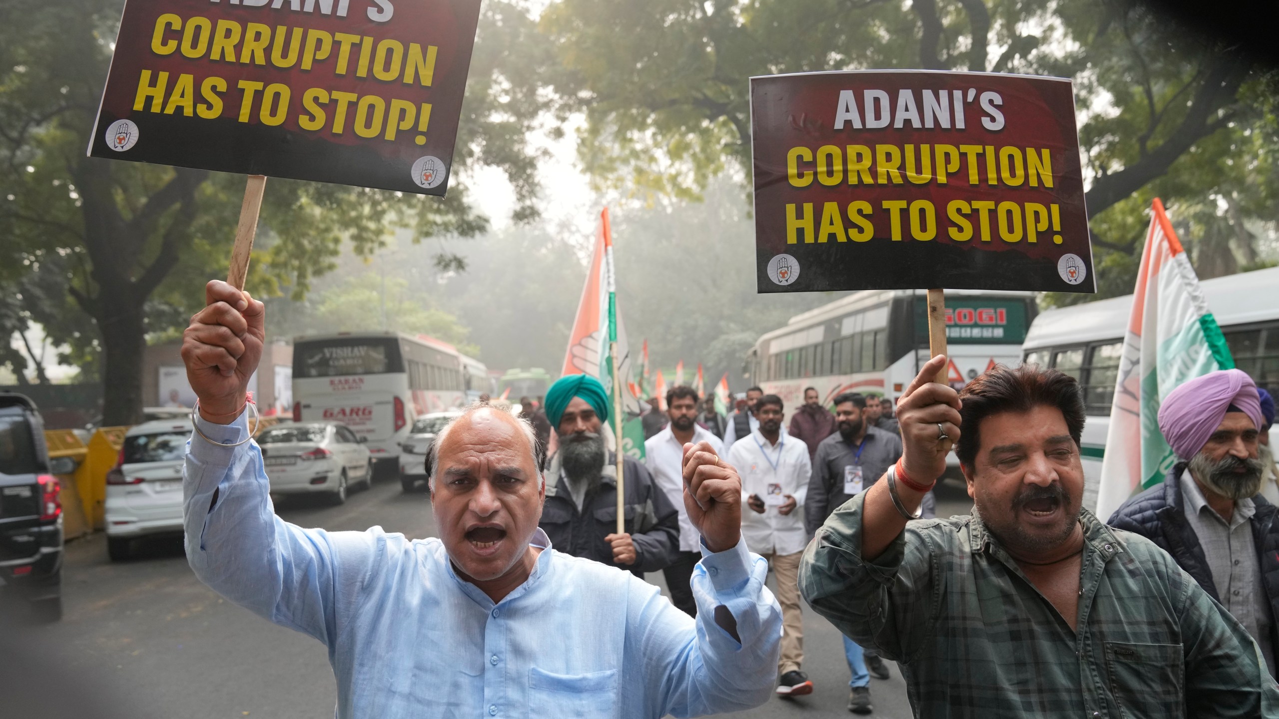 India's opposition Congress party members shout slogans during a protest against Indian billionaire Gautam Adani and Indian Prime Minister Narendra Modi after Adani was indicted by U.S. prosecutors for bribery and fraud, in New Delhi, India, Monday, Nov. 25, 2024. (AP Photo/Manish Swarup)