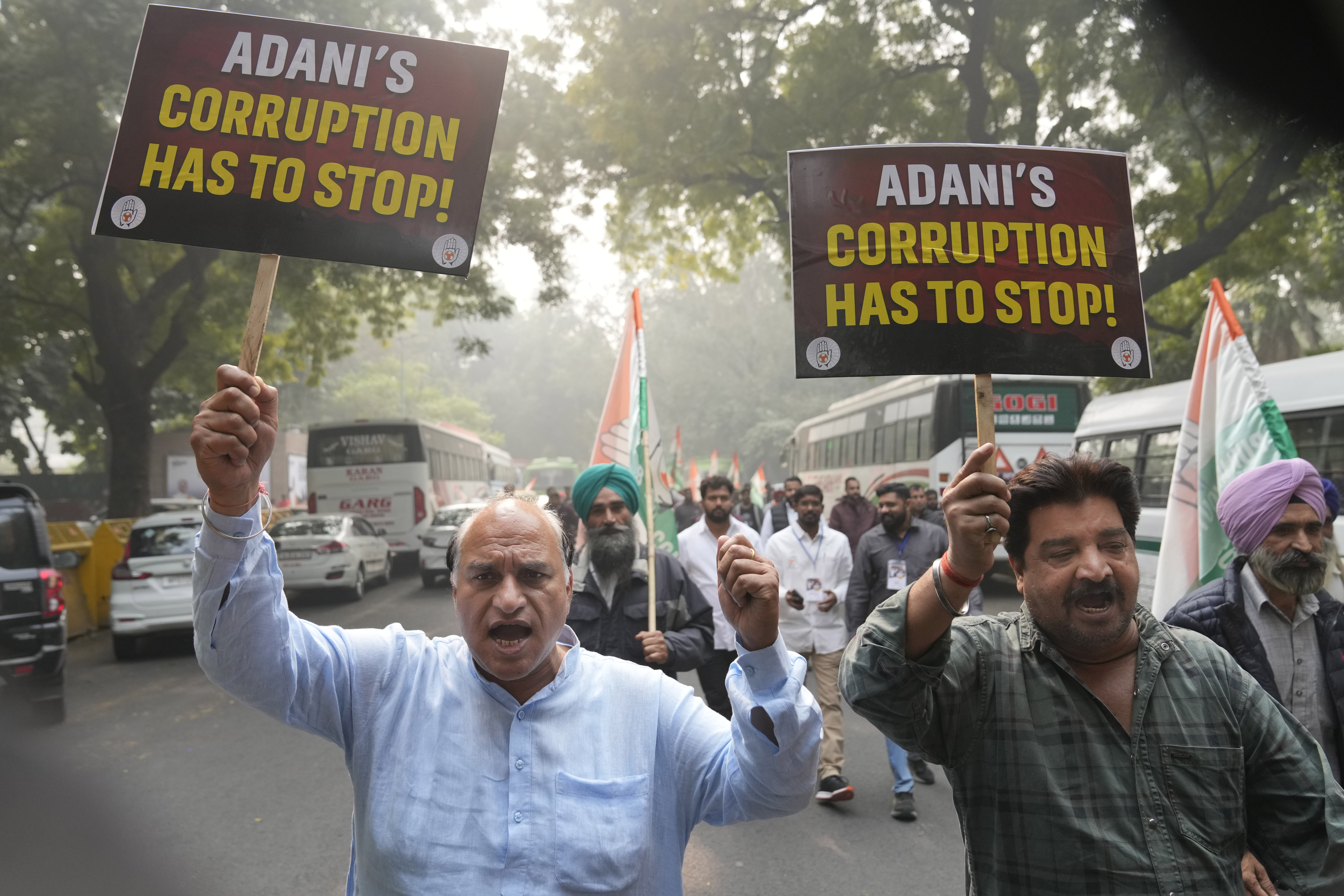 India's opposition Congress party members shout slogans during a protest against Indian billionaire Gautam Adani and Indian Prime Minister Narendra Modi after Adani was indicted by U.S. prosecutors for bribery and fraud, in New Delhi, India, Monday, Nov. 25, 2024. (AP Photo/Manish Swarup)