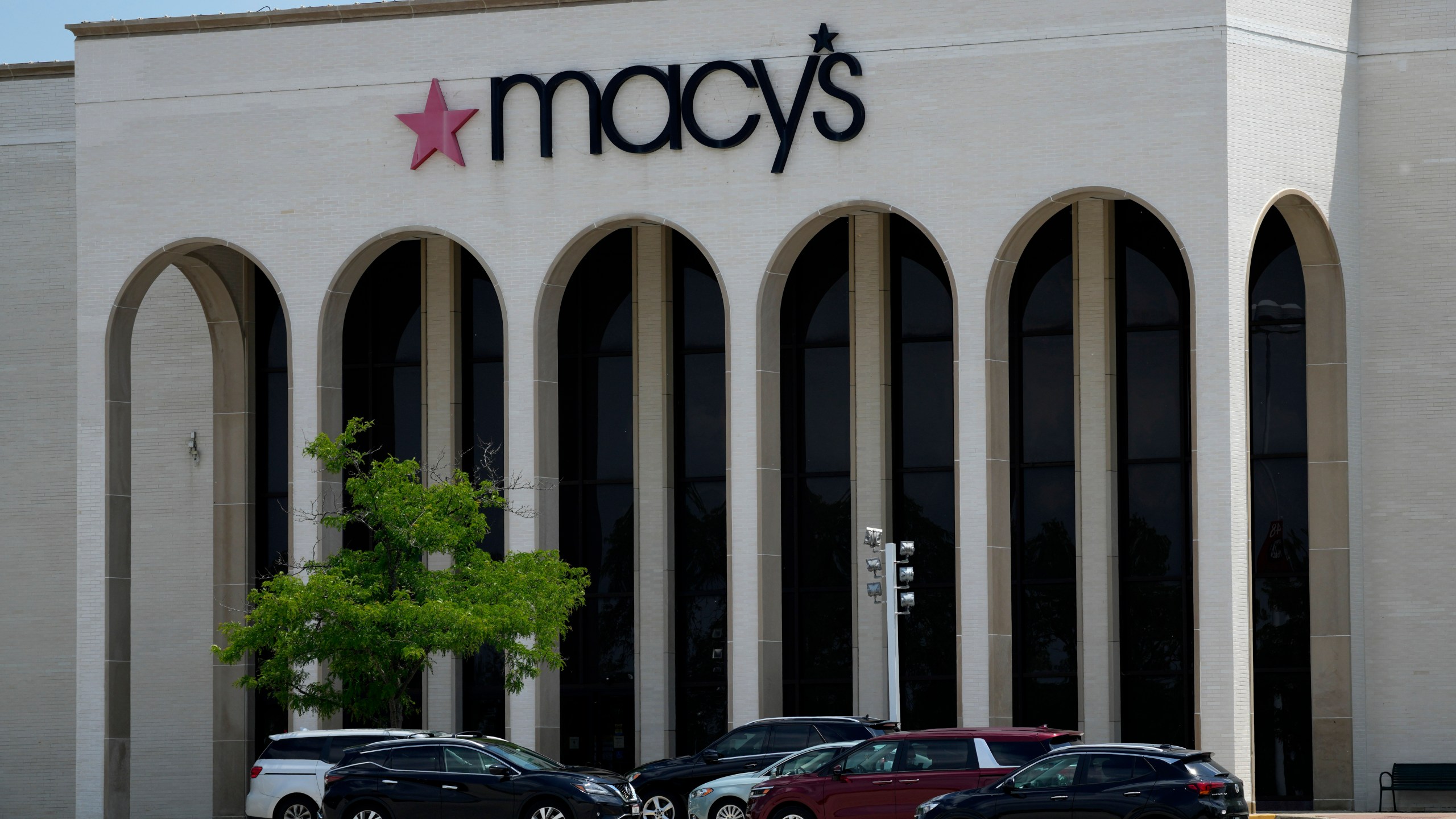 FILE - Cars are parked in front of a Macy's store at Hawthorn Mall in Vernon Hills, Ill., June 3, 2024. (AP Photo/Nam Y. Huh, File)