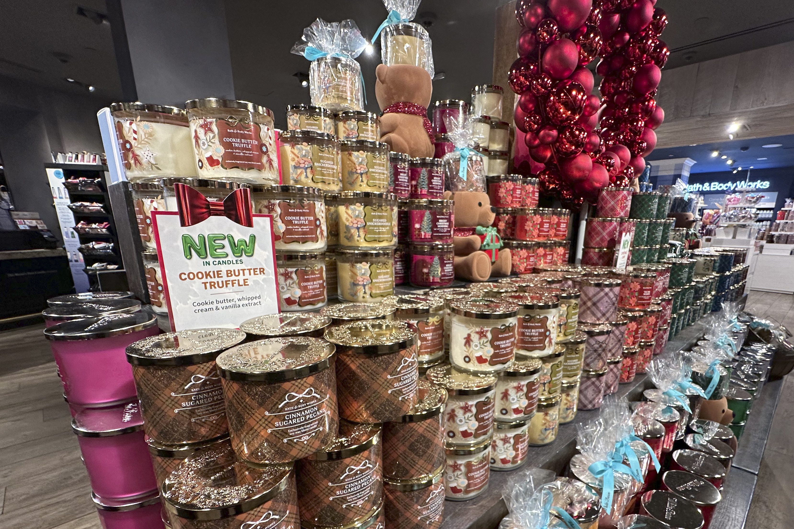 FILE - An arrangement of holiday themed scented candles is shown at a Bath & Body Works store on Oct. 9, 2024, in New York. (AP Photo/Peter Morgan)