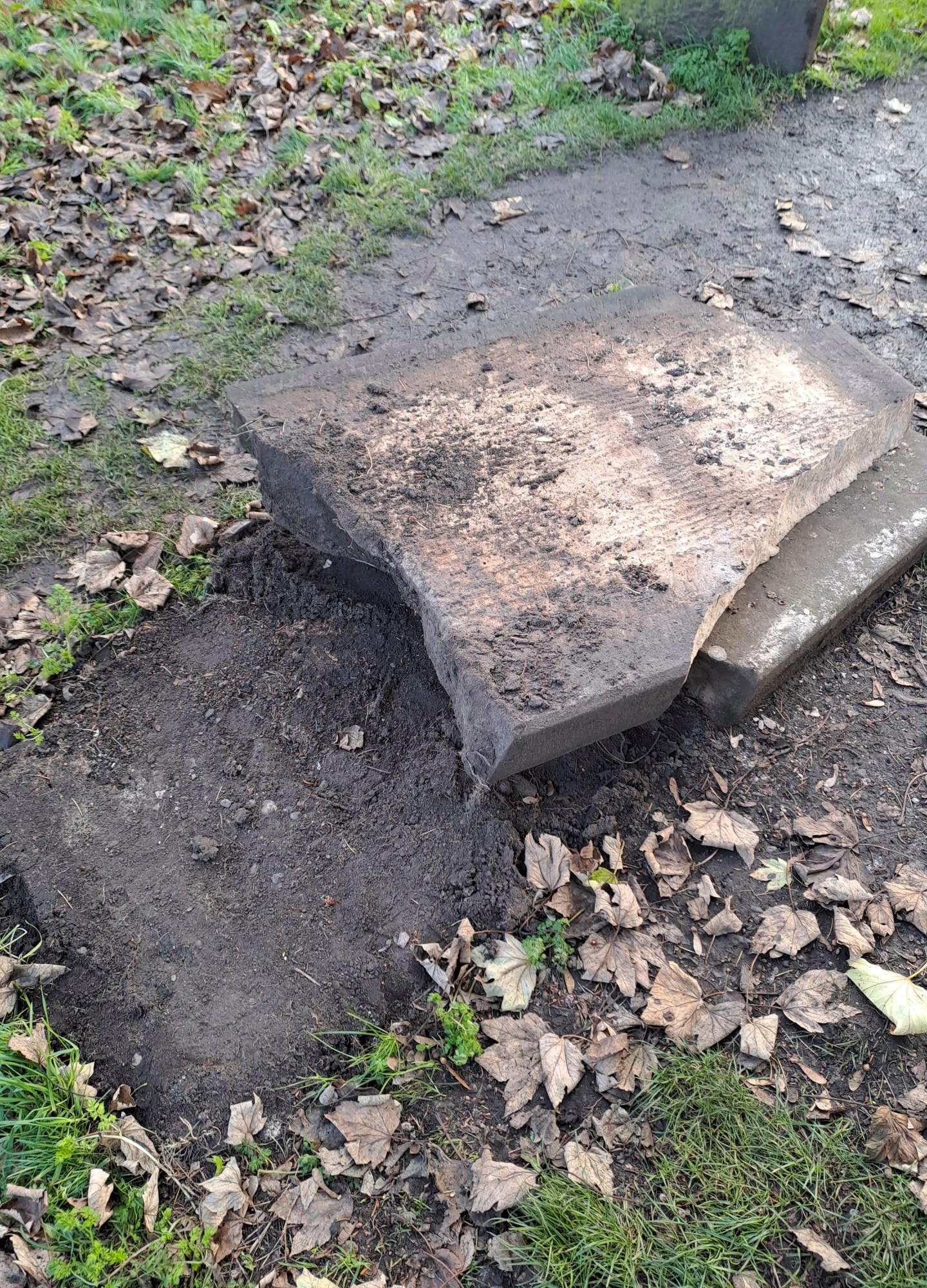 In this picture, provided by the West Mercia Police on Monday, Nov. 25, 2024, a smashed movie prop tombstone that was used for the "A Christmas Carol" movie is seen in Shrewsbury, England. (West Mercia Police via AP)